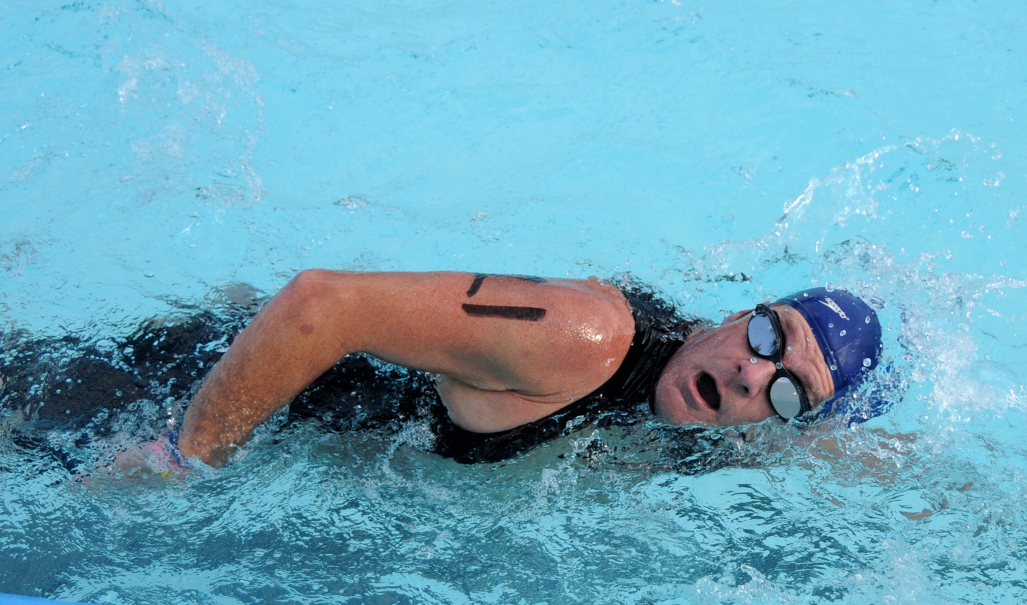 Jason Bright of Ocean Springs swims 200 yards at the Triangle Pool.  (U.S. Air Force photo by Kemberly Groue)