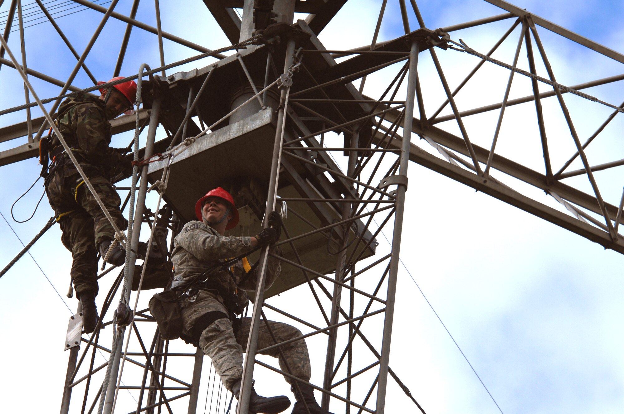 Tech. Sgt. Tim Daniel and Staff Sgt. Sean Lavely perform annual preventative maintenance inspections on an antenna systems Sept. 18, 2009, at Royal Air Force Barford, England. They are from Kapaun Air Station, Germany, as part of the 1st Communications Maintenance Squadron cable and antenna theater maintenance team. (U.S. Air Force photo/Tech. Sgt. Michael Voss) 