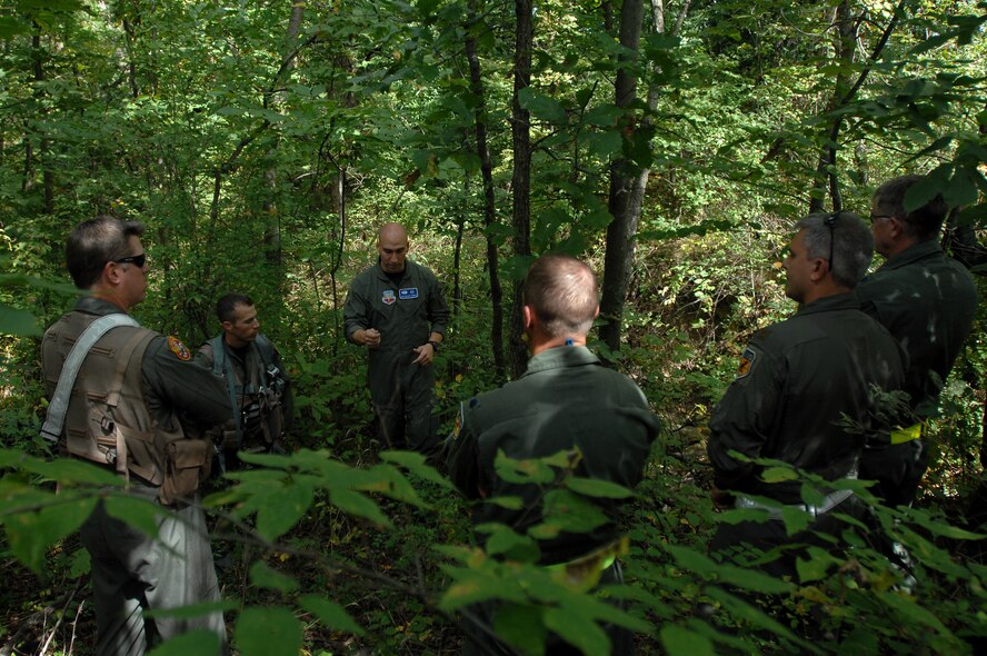 WHITEMAN AIR FORCE BASE, Mo. - Staff Sgt. Michael Garcia (center) , 509th Operations Support Squadron search and rescue specialist, trains 303rd Fighter Squadron pilots on the techniques needed to survive if their aircraft were to go down behind enemy lines, Sept. 16. The training was part of the 442nd Phase II exercise. (U.S. Air Force photo/Senior Airman Kenny Holston)