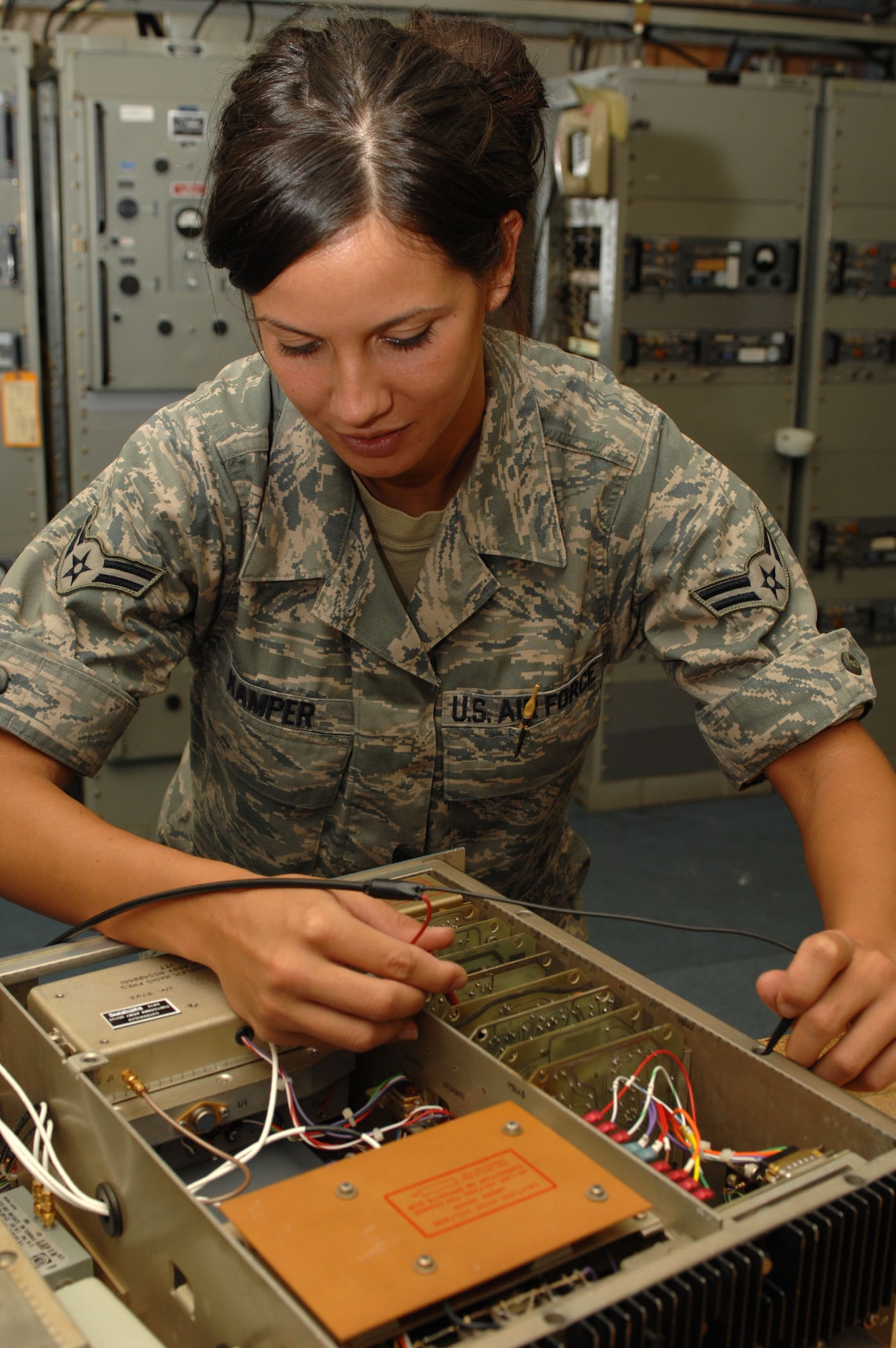 Airman 1st Class Tashia Kamper, 4th Communications Squadron airfield systems technician, tests audio voltage on a transmitter at Seymour Johnson Air Force Base, N.C., Sept. 16, 2009. Airfield systems technicians accomplish most of their training on-the-job because they do not have specific training equipment. (U.S. Air Force photo y Staff Sgt. Heather Stanton)