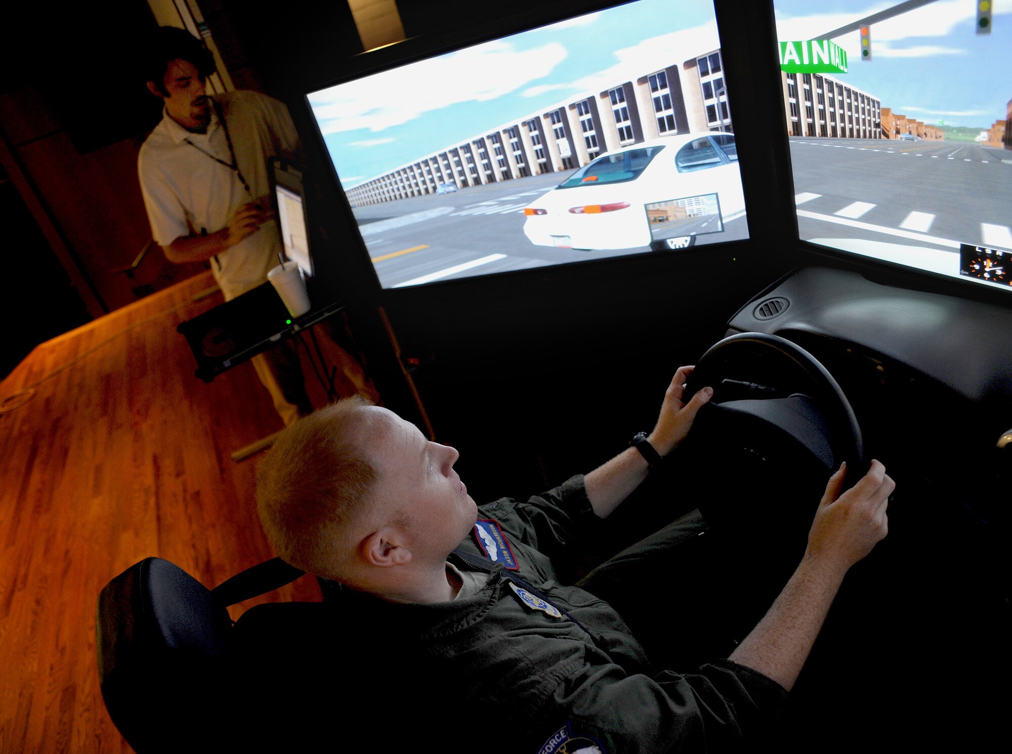 Capt. Jason Richardson tests out a drunk driving simulator at the base theater here during the Save a Life Tour Sept. 22. The multi-million dollar simulators used by Save a Life Tour are the only simulators in the country which give participants a completely realistic, sober perspective on the effects of driving while intoxicated. Captain Richardson is a flight safety officer with the 437th Airlift Wing Safety Office. (U.S. Air Force photo/Senior Airman Katie Gieratz)
