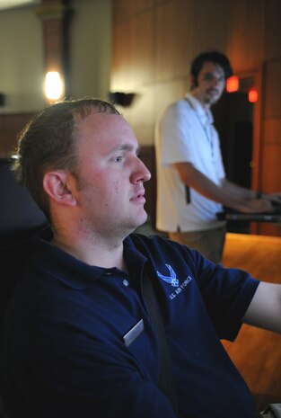Airman 1st Class Kenneth Hales tests his driving abilities on a drunk driving simulator at the base theater here during the Save a Life Tour Sept. 22. The Save a Life Tour brings a shocking approach to alcohol awareness with a tragic video, personal stories of the loss of loved ones by peers and a sobering drunk driving simulation experience. Airman Hales is a fitness specialist with the 437th Force Support Squadron. (U.S. Air Force photo/Senior Airman Katie Gieratz)