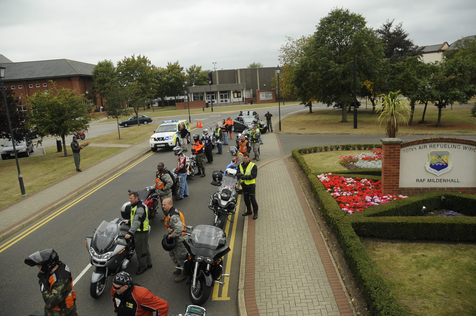 Bikers dismount their bikes and join together around the POW/MIA memorial to have a moment of silence during a wreath laying, Sept. 15, 2009, RAF Mildenhall, England. Several Stops were made to remember military prisoners of war and those missing in action. (U.S. Air Force photo/ Airman 1st Class Eboni Knox)