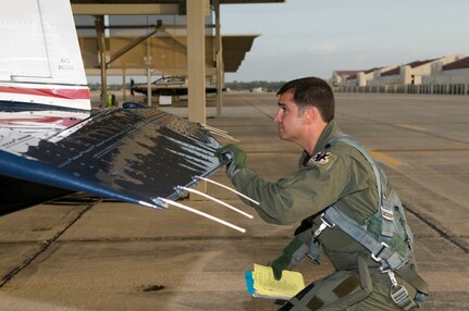 Lt Col Ryan Jara, 559th Flying Training Squadron, conducts a pre-flight check on a T-6 Texan II aircraft Aug. 19.  (U.S. Air Force photo/Joel Martinez)