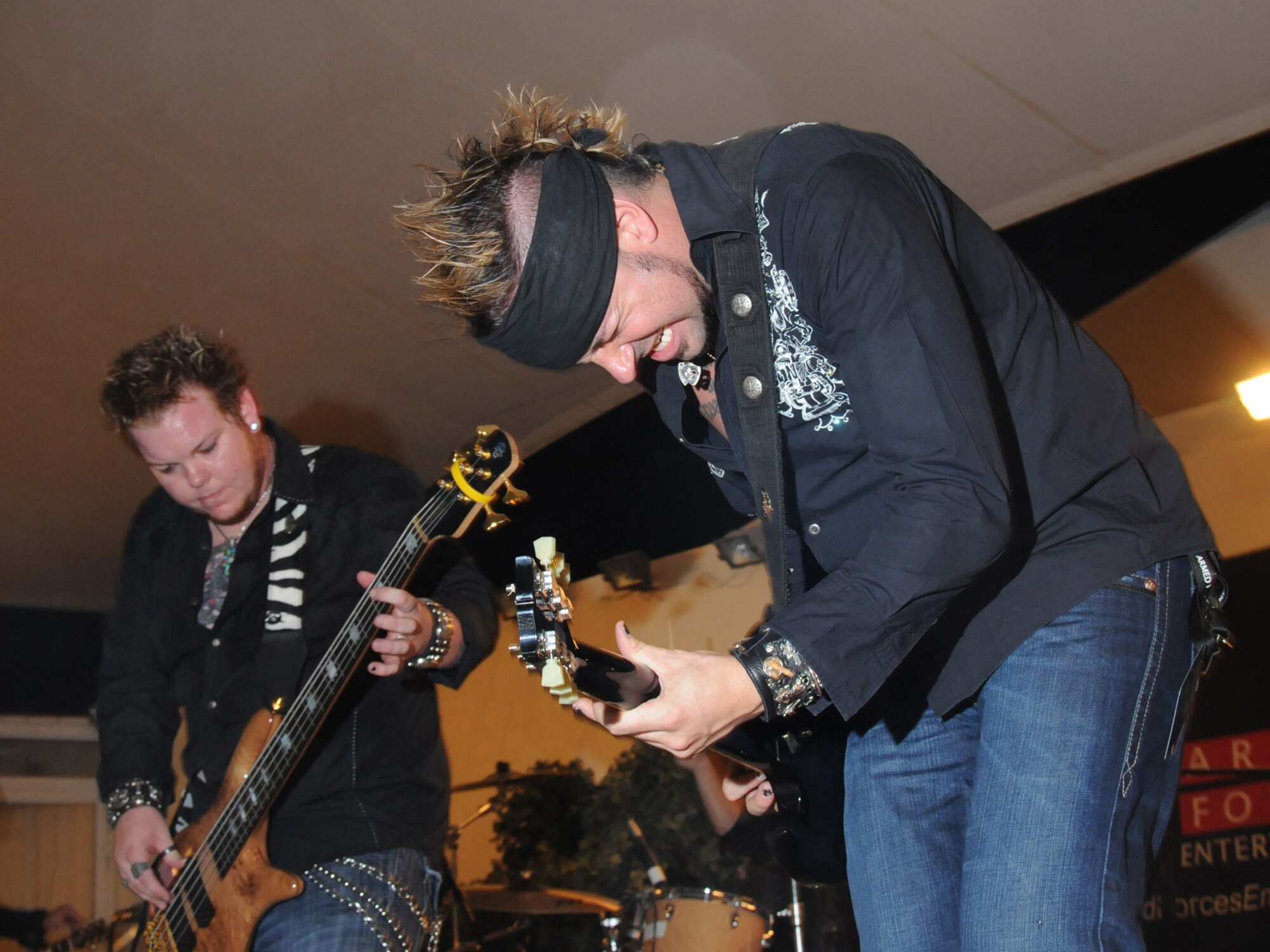 Ember performs for a live audience of deployed service members, here, Sept. 22. Ember is an Austin, Texas-based band performing in Southwest Asia as part of an Armed Forces Entertainment-sponsored tour. (U.S. Air Force Photo/Tech. Sgt. Jason W. Edwards) 