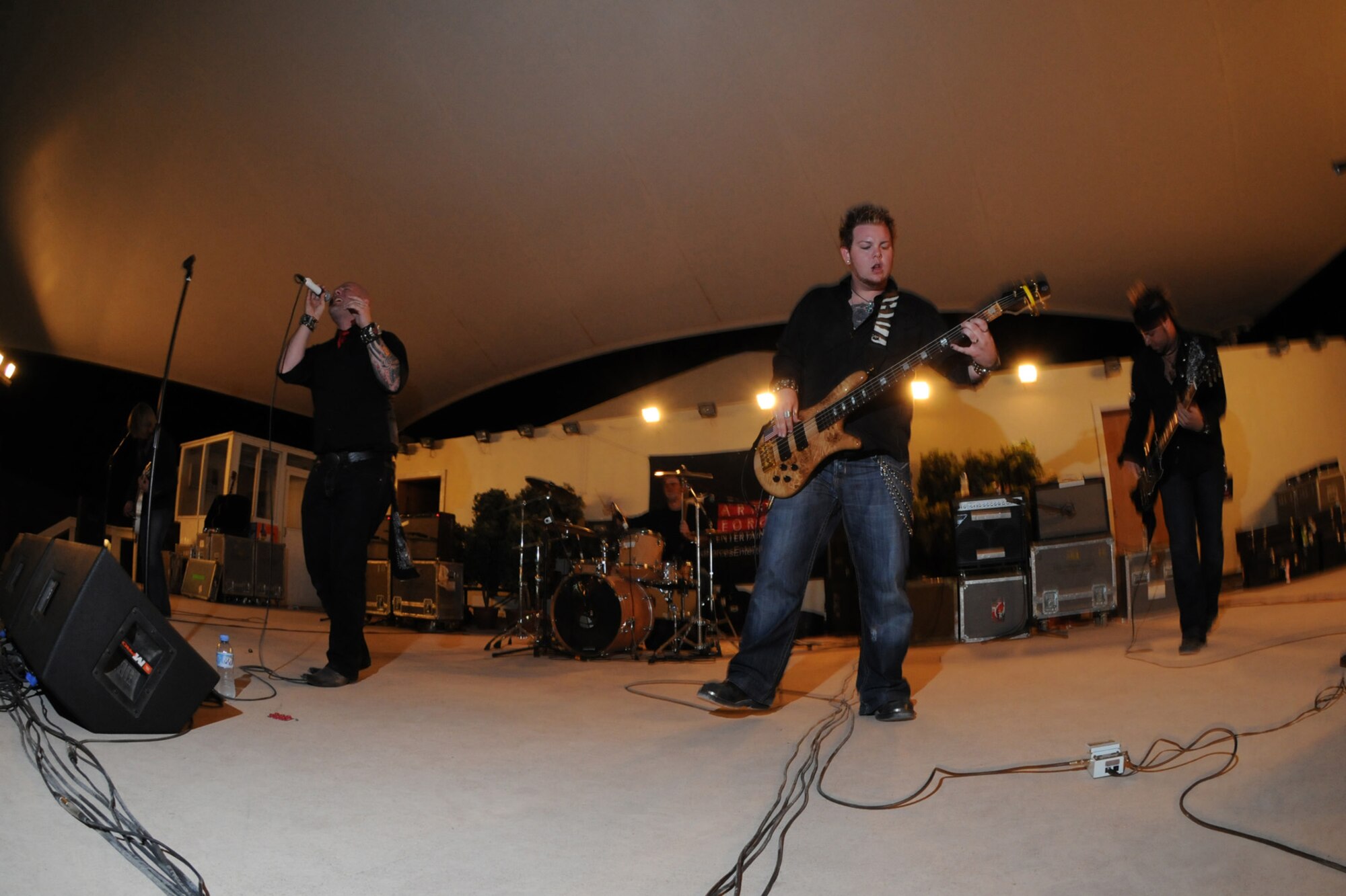 Ember performs for a live audience of deployed service members, here, Sept. 22. Ember is an Austin, Texas-based band performing in Southwest Asia as part of an Armed Forces Entertainment-sponsored tour. (U.S. Air Force Photo/Tech. Sgt. Jason W. Edwards)