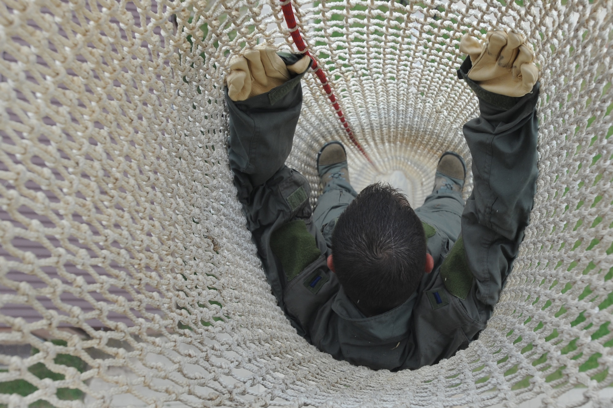 WHITEMAN AIR FORCE BASE, Mo. - Airman First Class Christopher Palacio,509th Operation Support Squadron, descends down the fire escape from the Whiteman tower,  Sept. 22. Anyone who works in the tower must complete the training to ensure they know what to expect in the descent of the extreme drop. (U.S. Air Force photo/Airman 1st Carlin Leslie)