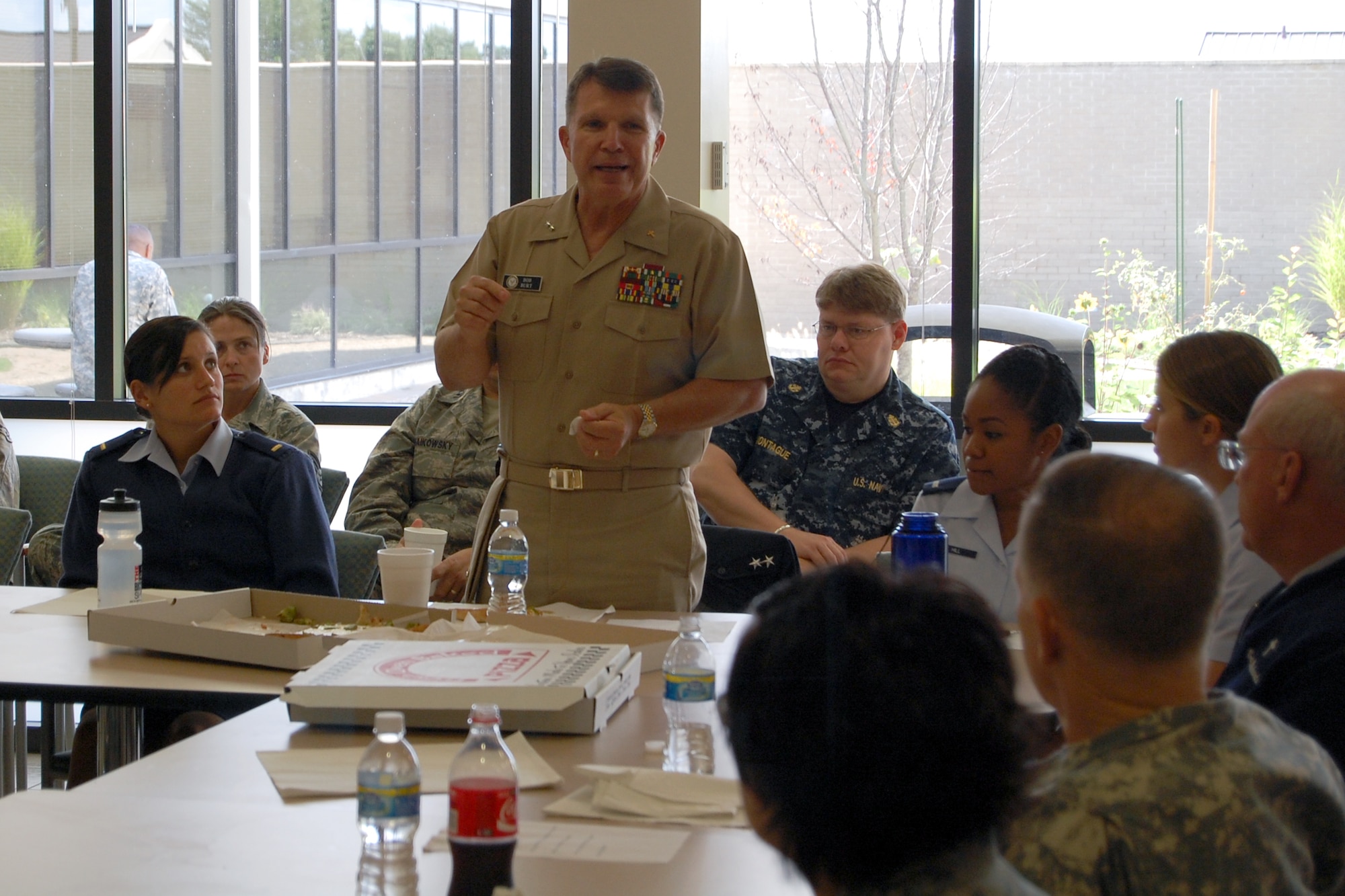 Chaplain (Rear Adm.) Robert Burt, U.S. Navy participates in pizza and conversation at Air Force Mortuary Affairs Operations Center (AFMAO) on Sept. 21, 2009. U.S. Air Force Photo by 1st Lt. Joseph Winter