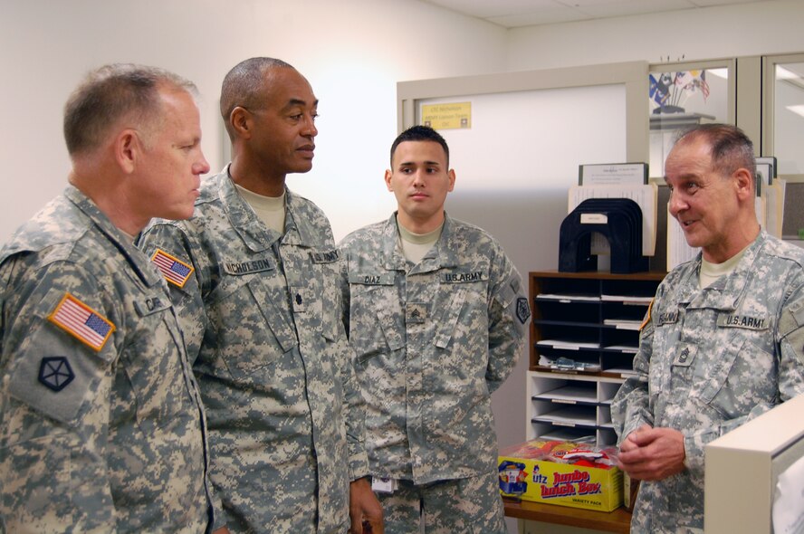 Chaplain (Maj. Gen.) Douglas Carver , U.S. Army visits with Army Liaison team at Air Force Mortuary Affairs Operations Center (AFMAO) on Sept. 21, 2009. U.S. Air Force photo by 1st Lt. Joseph Winter.