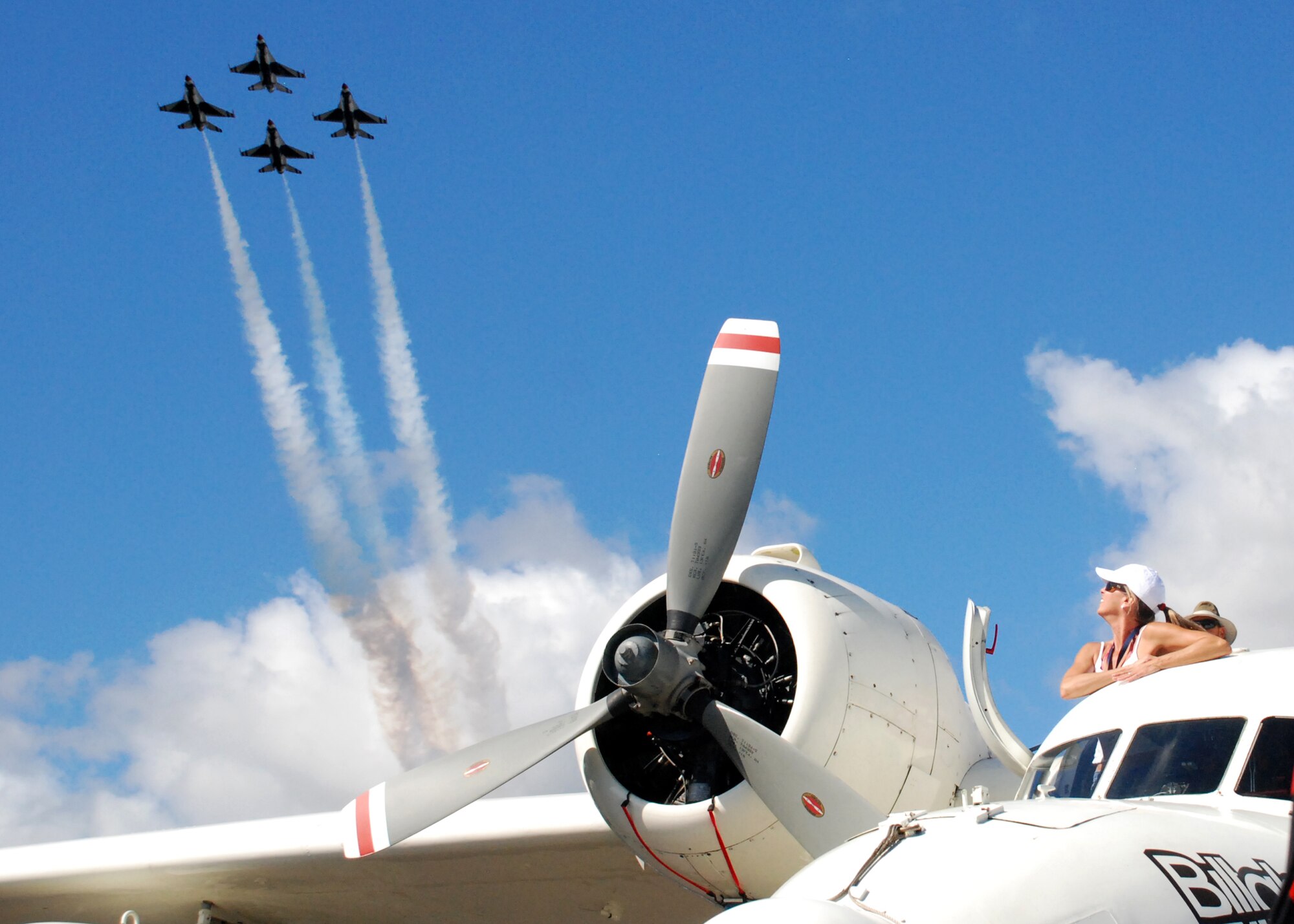 HICKAM AIR FORCE BASE, Hawaii -- The Thunderbirds, U.S. Air Force Demonstration Squadron, fly their world famous four-ship diamond formation over the Grumman GSA-16A "Albatross" amphibian over Hickam Air Force Base, Hawaii, during the "Wings Over the Pacific," Open House Sept. 20. The Billabong Clipper is a refitted 50-year-old military seaplane with the latest in high-tech gear for the world's top surfers to seek out and ride the planets toughest waves. The Thunderbirds demonstrate the capabilities the F-16 Fighting Falcon by performing combat maneuvers during their aerial demonstration. This is Hickam's first open house since 2003, and a crowd of nearly 100,000 paid a visit during the weekend. (U.S. Air Force photo/Staff Sgt. Mike Meares)