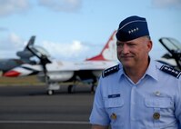 HICKAM AIR FORCE BASE, Hawaii -- Gen. Gary North, Commander, Pacific Air Forces, passes in front of the Thunderbirds lined across show center after the Thunderbirds final performance at Hickam's 2009 "Wings Over the Pacific" Open House Sept. 20. The Thunderbirds demonstrate the capabilities the F-16 Fighting Falcon by performing combat maneuvers during their aerial demonstration. This is Hickam's first open house since 2003, and a crowd of nearly 100,000 paid a visit during the weekend. (U.S. Air Force photo/Staff Sgt. Mike Meares)