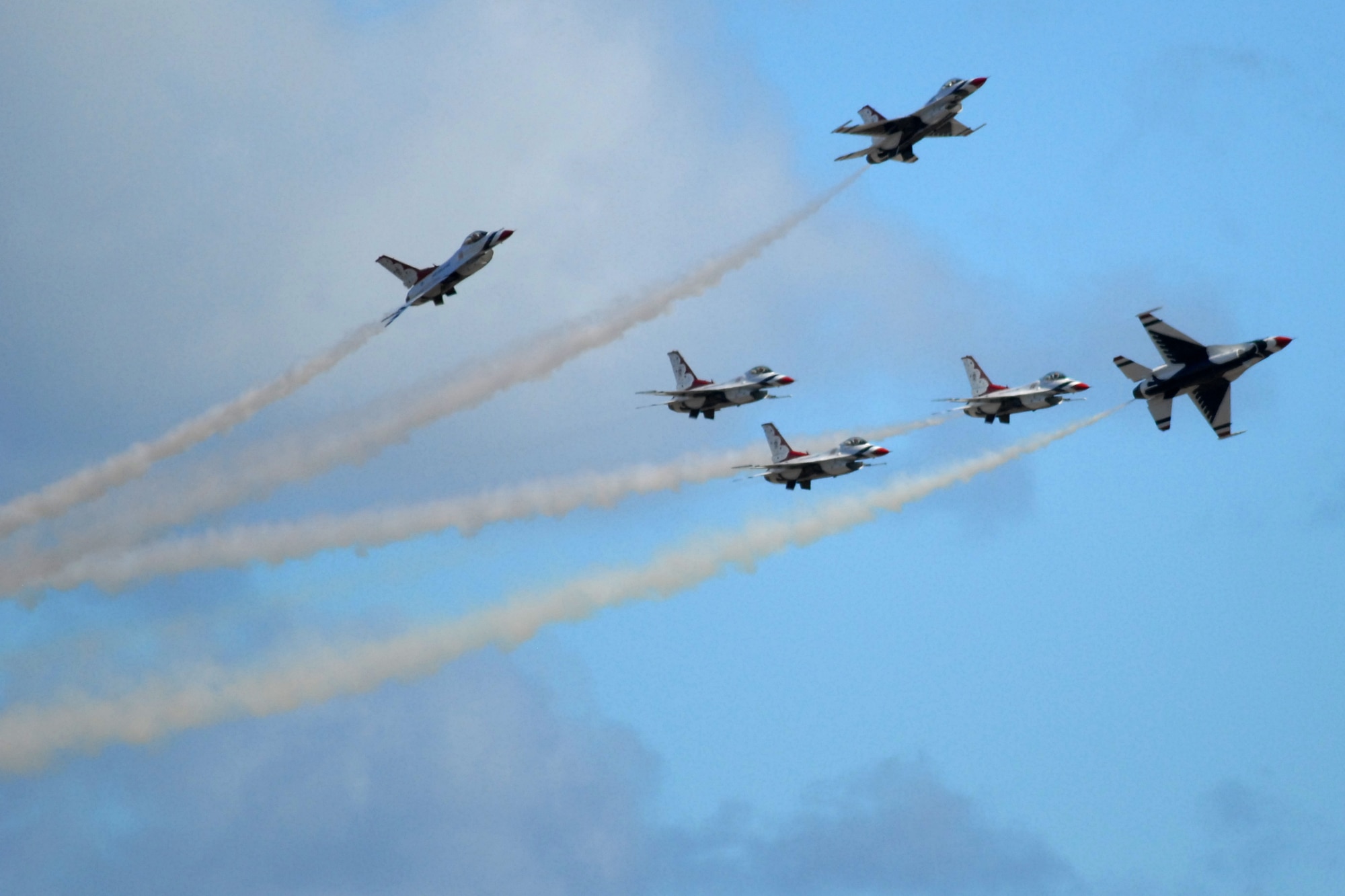 HICKAM AIR FORCE BASE, Hawaii -- The Thunderbirds, U.S. Air Force Demonstration Squadron, perform over Hickam Air Force Base, Hawaii, during the "Wings Over the Pacific," Open House Sept. 20 before a crowd of more than 57,000. The Thunderbirds demonstrate the capabilities the F-16 Fighting Falcon by performing combat maneuvers during their aerial demonstration. This is Hickam's first open house since 2003, and a crowd of nearly 100,000 paid a visit during the weekend. (U.S. Air Force photo/Staff Sgt. Mike Meares)