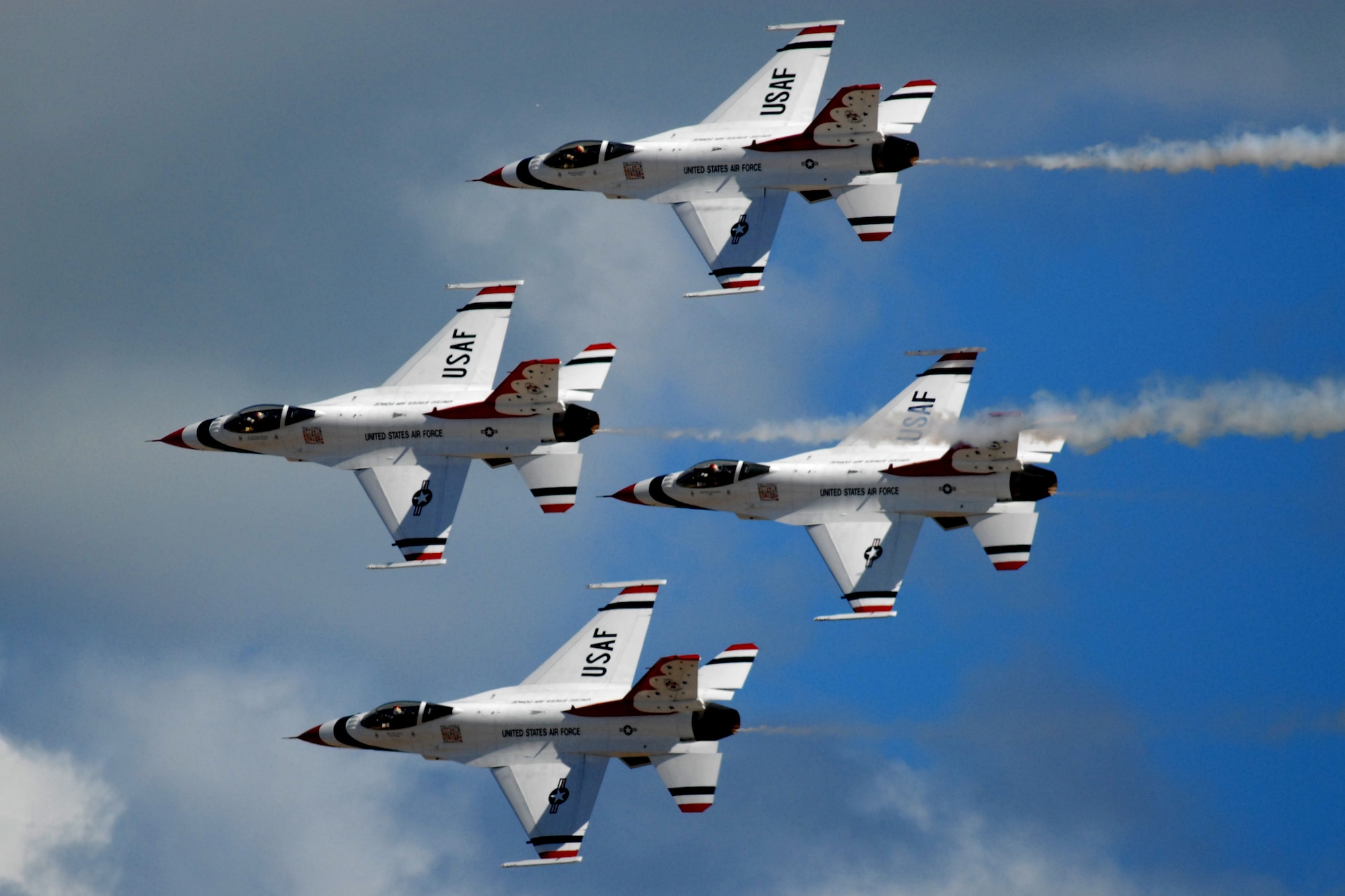 HICKAM AIR FORCE BASE, Hawaii -- The Thunderbirds, U.S. Air Force Demonstration Squadron, perform over Hickam Air Force Base, Hawaii, during the "Wings Over the Pacific," Open House Sept. 20 before a crowd of more than 57,000. The Thunderbirds demonstrate the capabilities the F-16 Fighting Falcon by performing combat maneuvers during their aerial demonstration. This is Hickam's first open house since 2003, and a crowd of nearly 100,000 paid a visit during the weekend. (U.S. Air Force photo/Staff Sgt. Mike Meares)