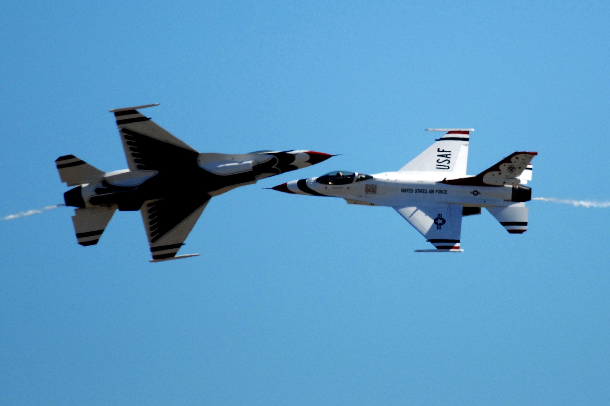 HICKAM AIR FORCE BASE, Hawaii -- The Thunderbirds, U.S. Air Force Demonstration Squadron, perform over Hickam Air Force Base, Hawaii, during the "Wings Over the Pacific," Open House Sept. 20 before a crowd of more than 57,000. The Thunderbirds demonstrate the capabilities the F-16 Fighting Falcon by performing combat maneuvers during their aerial demonstration. This is Hickam's first open house since 2003, and a crowd of nearly 100,000 paid a visit during the weekend. (U.S. Air Force photo/Staff Sgt. Mike Meares)