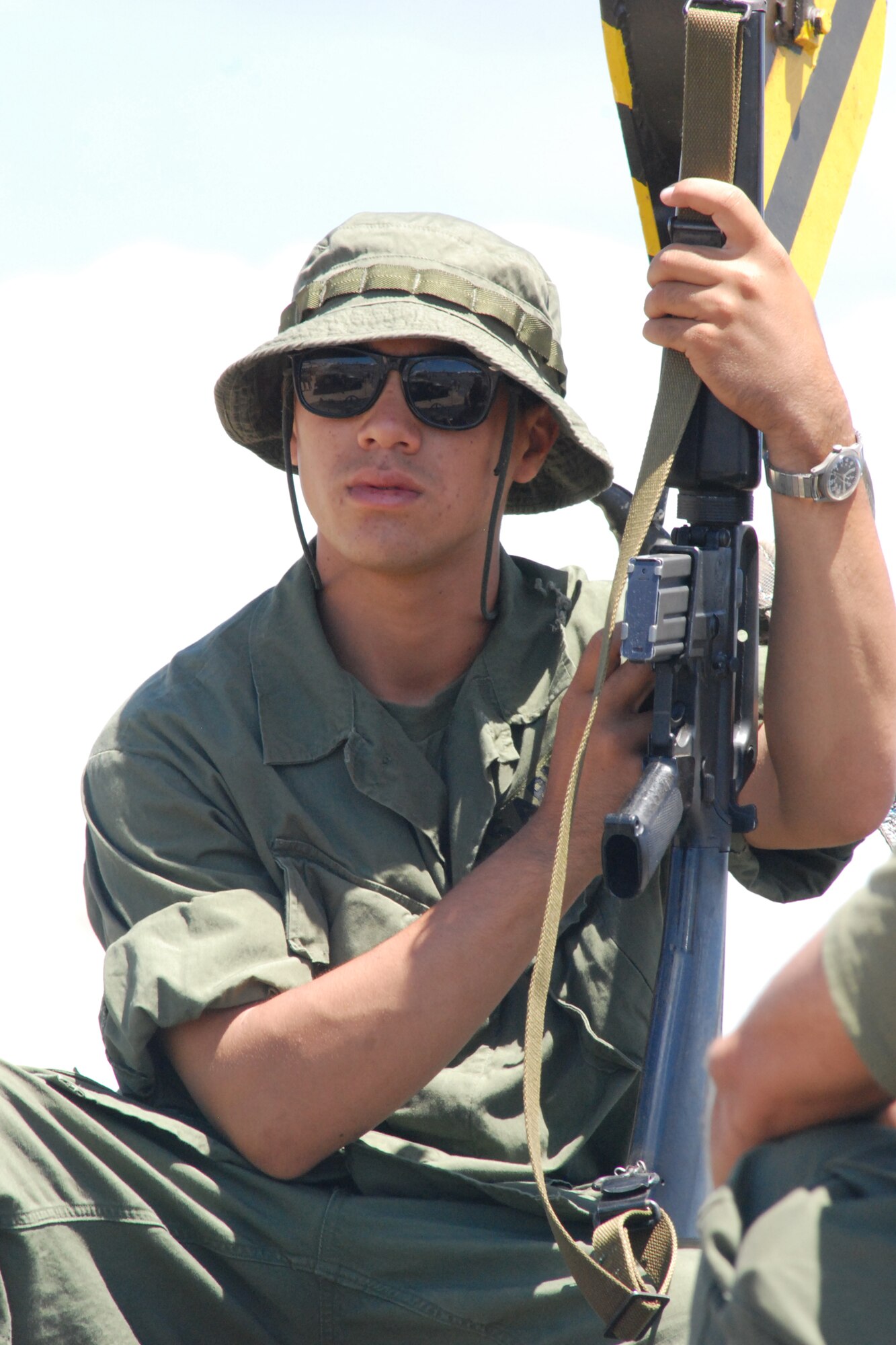 HICKAM AIR FORCE BASE, Hawaii -- Reeves Kanakaole, a volunteer with the Hawaii Museum of Military Vehicles, is dressed as an Army rifleman from the Vietnam era for the HMMV display at the ?Wings over the Pacific? Open House Sept. 19. The Thunderbirds, U.S. Air Force Demonstration Squadron, were the headliners during the open house. They demonstrate the capabilities the F-16 Fighting Falcon by performing combat maneuvers during their aerial demonstration. This is Hickam's first open house since 2003, and a crowd of nearly 100,000 paid a visit during the weekend. (U.S. Air Force photo/Staff Sgt. Mike Meares)