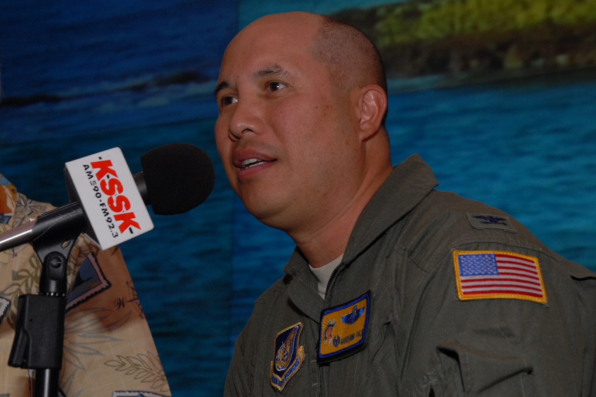 WAIKIKI, Hawaii -- Col. Giovanni Tuck, 15th Airlift commander, speaks with Michael Perry during a live broadcast of the Perry and Price Show at Jimmy Buffet?s restaurant at the Ohana Waikiki Beachcomber Hotel Sept. 19. Colonel Tuck answered questions about Hickam Air Force Base?s Open House, ?Wings Over the Pacific.? The Thunderbirds, U.S. Air Force Demonstration Squadron, were the headliners during the open house. They demonstrate the capabilities the F-16 Fighting Falcon by performing combat maneuvers during their aerial demonstration. This is Hickam's first open house since 2003, and a crowd of nearly 100,000 paid a visit during the weekend. (U.S. Air Force photo/Staff Sgt. Mike Meares)