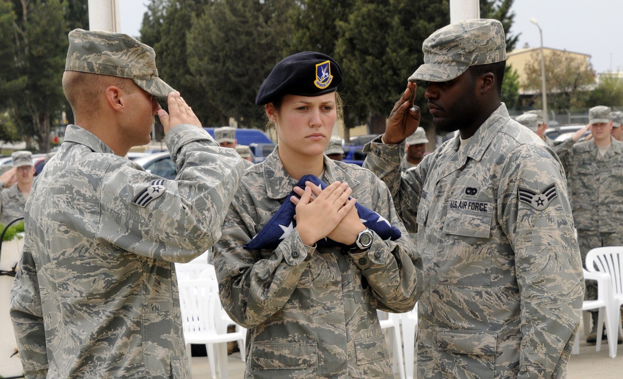 (From left to right) Senior Airman Joseph Hall, Senior Airman Nikki Brisco and Senior Airman Christopher Craig, Airman Leadership School students, perform the flag detail Friday, Sept. 18, 2009 during the POW/MIA Recognition Day ceremony at Incirlik Air Base, Turkey. POW/MIA Recognition Day is observed on the third Friday of each year, this year being the same day as the U.S. Air Force’s 62nd birthday. This day helps the nation remember those imprisoned while serving in conflict and those who remain missing in action. (U.S. Air Force photo/Airman 1st Class Amber Ashcraft)