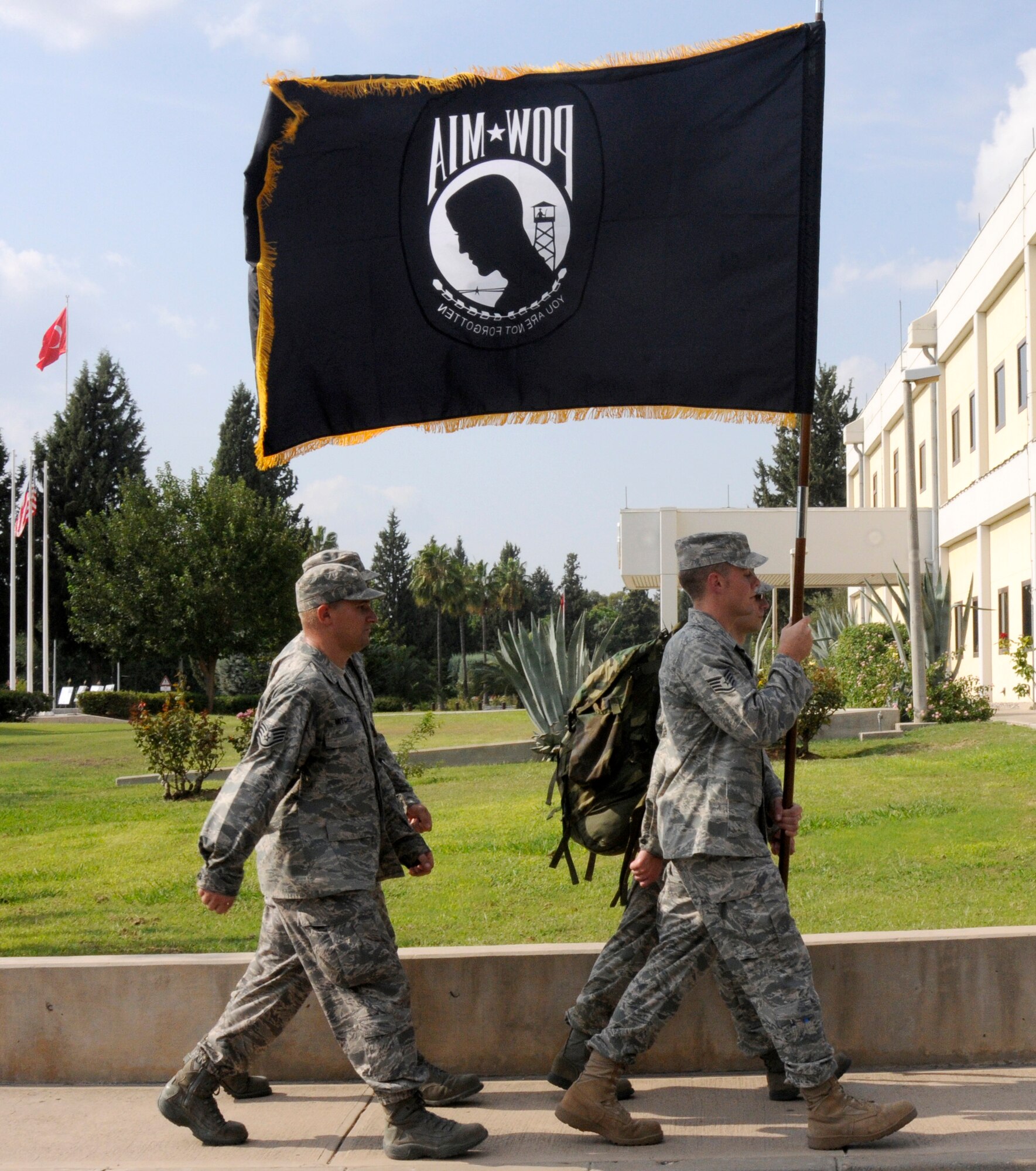 Members from the 39th Operations Squadron begin the last rucksack march of the day Friday, Sept. 18, 2009, in honor of POW/MIA Recognition Day at Incirlik Air Base, Turkey. The 50 lb rucksack and POW/MIA flag were kept in continuous motion for eight hours, to recognize the pain and suffering POW/MIA service members and their families endure. (U.S. Air Force photo/Airman 1st Class Amber Ashcraft)