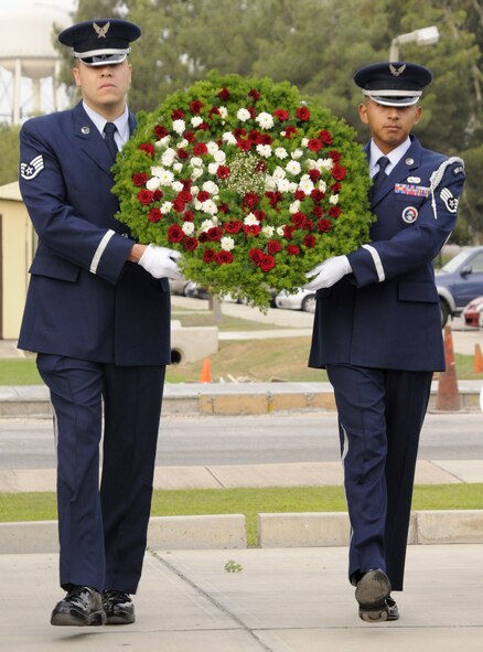 Staff Sgt. Juan Morales(left) and Staff Sgt. Ismael Rodriguez (right), members of Incirlik’s Honor Guard, present the wreath Friday, Sept. 18, 2009, during the wreath laying ceremony for the POW/MIA Recognition Day ceremony at Incirlik Air Base, Turkey. POW/MIA Recognition Day is observed on the third Friday in September, this year being the same day as the U.S. Air Force’s 62nd birthday. This day helps the nation remember those imprisoned while serving in conflict and those who remain missing in action. (U.S. Air Force photo/Airman 1st Class Amber Ashcraft) 