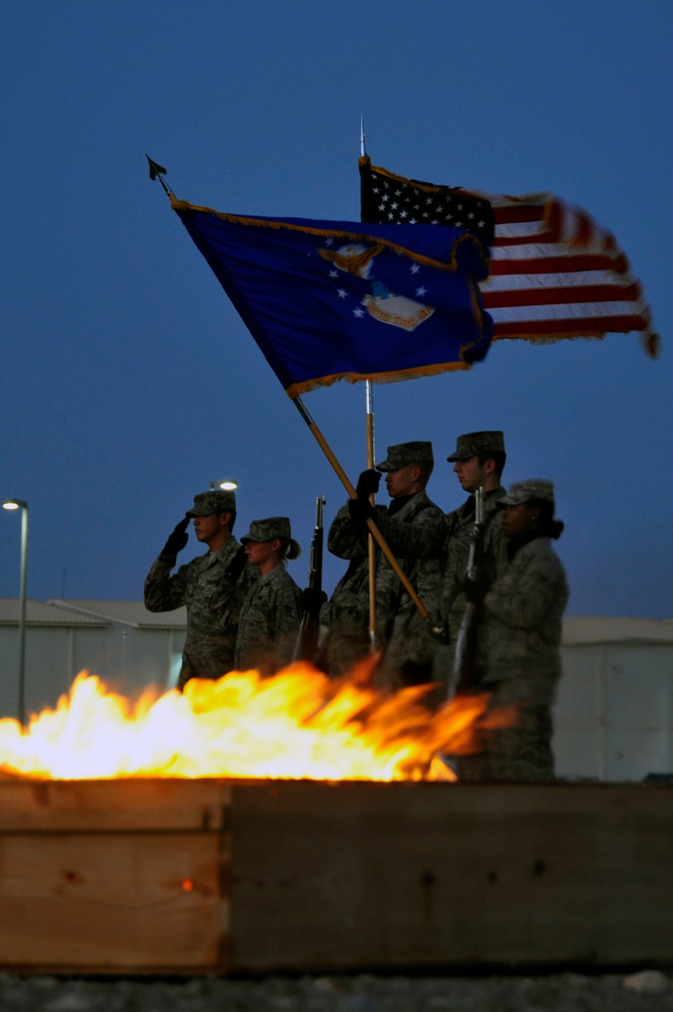 SOUTHWEST ASIA -Members of the 380th Air Expeditionary Wing honor guard, ceremoniously destroy an unserviceable American flag during a Flag Retirement Ceremony Sept. 18, 2009. (U.S. Air Force photo/Tech. Sgt. Charles Larkin Sr) 