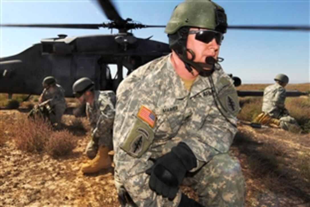 U.S. Army soldiers depart an HH-60 Pave Hawk helicopter during training on Orchard Training Area, Idaho, Sept. 16, 2009. The soldiers are assigned to the Utah Army National Guard, 19th Special Forces Group, and the helicopter crew is assigned to the 34th Weapons Squadron, United States Air Force Weapons School, Nellis Air Force Base, Nev. The 34th Weapons Squadron is conducting the terminal employment phase of the Nellis Weapons School syllabus.