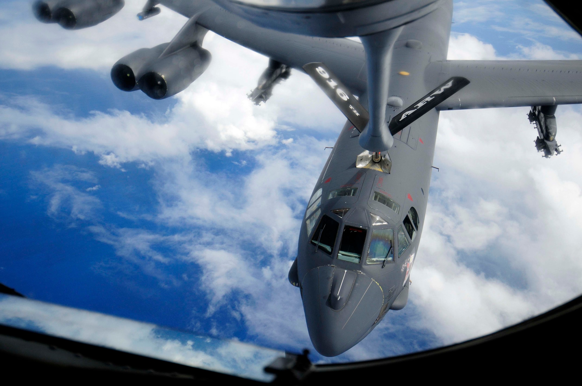 A B-52 Stratofortress from the 96th Expeditionary Bomb Squadron takes on fuel over the Pacific Ocean during a Green Lightning exercise Sept. 22. The B-52 flew to an Australian training range where the aircrew coordinated a simulated strike with Australian joint terminal attack controllers. (U.S. Air Force photo/Airman 1st Class Courtney Witt)