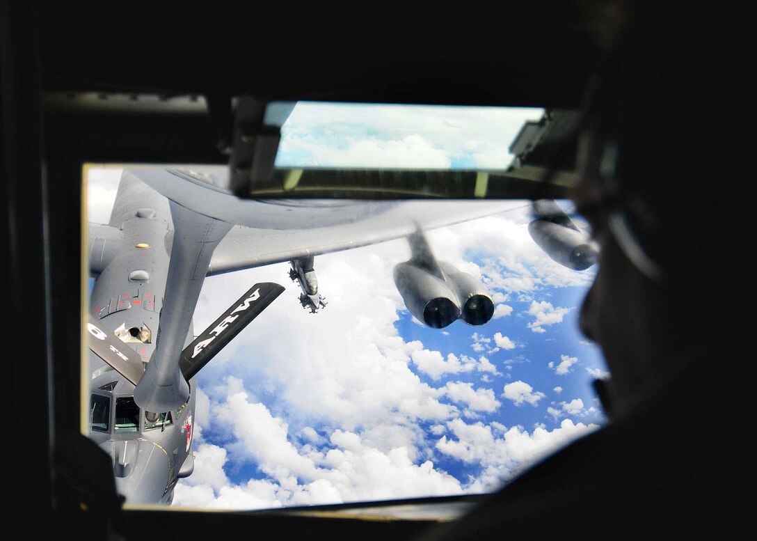 Tech. Sgt. Riccardo Bonicelli from the 77th Air Refueling Squadron refuels a B-52 Stratofortress during a Green Lightning exercise over the Pacific Ocean Sept. 22.  The B-52 flew to an Australian training range where the aircrew coordinated a simulated strike with Australian joint terminal attack controllers. (U.S. Air Force photo/Airman 1st Class Courtney Witt)