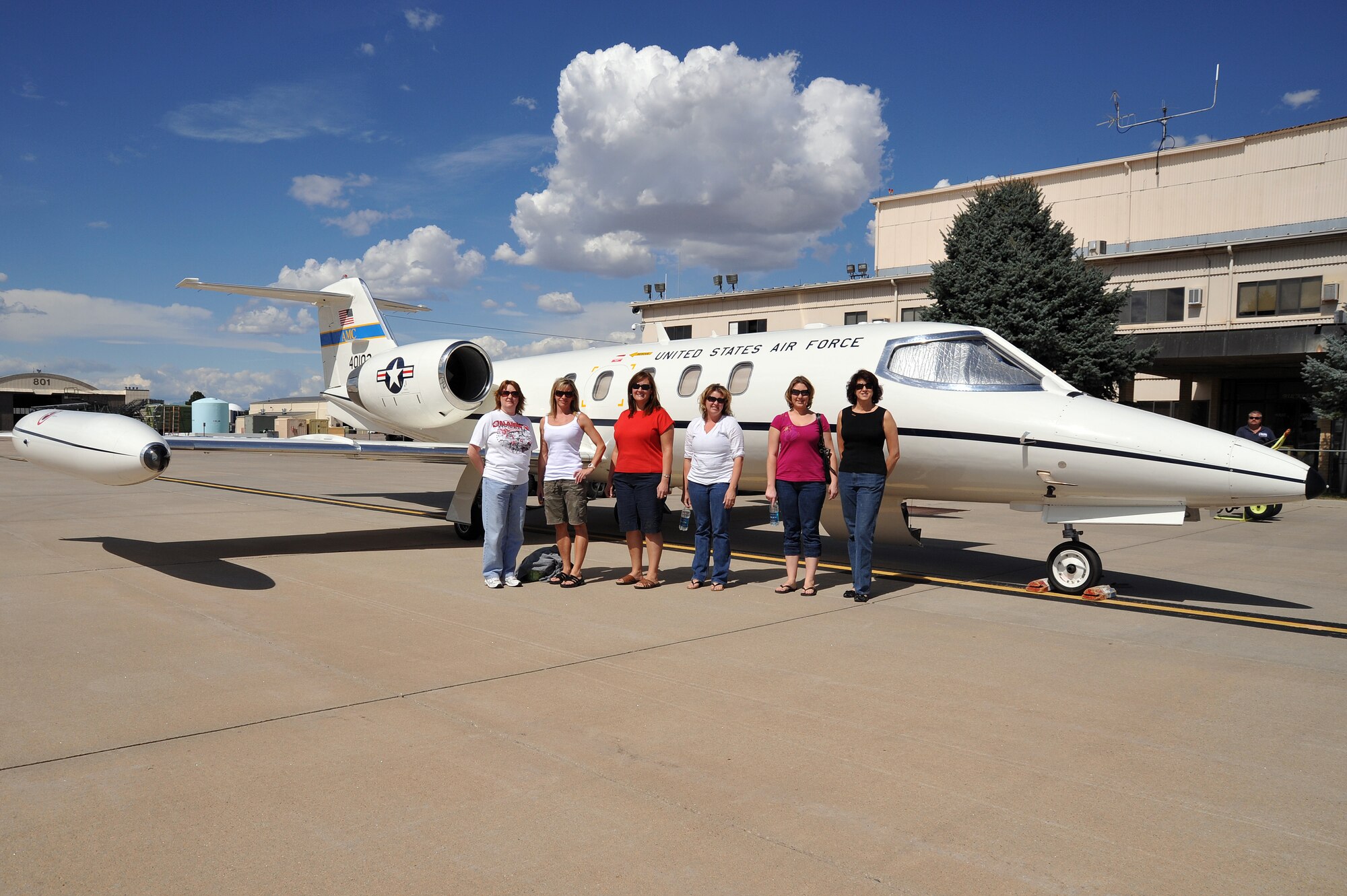 Left to right, Paula Tootle, Denise Meika , Anna Morgan, Melisa Danielson, Rebecca Stumpf and Liz Rohrer pose with a C-21 flown by the 200th Airlift Squadron out of Buckley Air Force Base, September 20, 2009.  The Colorado Air National Guard is honoring its spouses this week in appreciation of all their support by giving them incentive flights in a C-21 over the state of Colorado. (U.S. Air Force photo by Tech. Sgt. Wolfram M. Stumpf, Colorado Air National Guard/Released) 