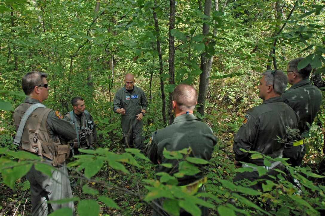 Near Whiteman Air Force Base, Mo., Staff Sgt. Michael Garcia (center) trains 303rd Fighter Squadron A-10 Thunderbolt II pilots Sept. 16, 2009, on the techniques needed to survive if their aircraft were to go down behind enemy lines.  Sergeant Garcia is a search and rescue specialist with the 509th Operations Support Squadron. (U.S. Air Force photo/Senior Airman Kenny Holston)