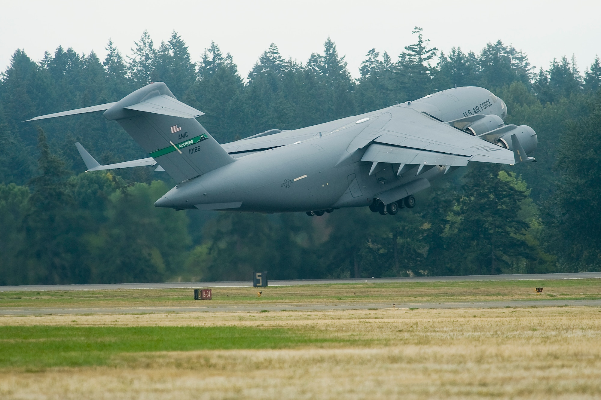 A C-17 Globemaster III takes off at McChord Sept. 24, ultimately headed to Antarctica for missions in support of Operation Deep Freeze. (U.S. Air Force photo/Abner Guzman)