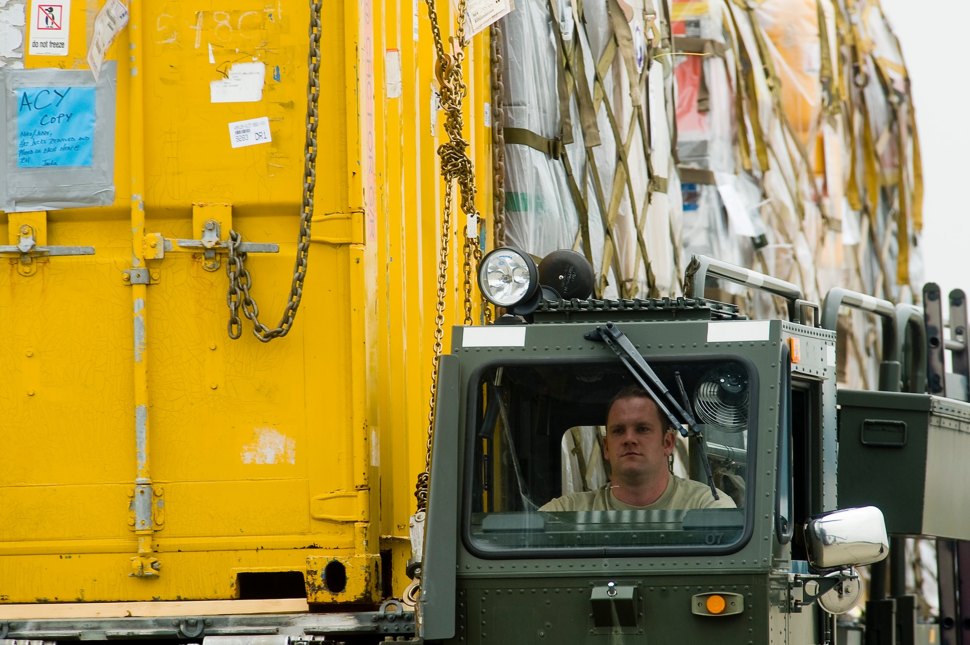 Senior Airman Austin Johnson, 62nd Aerial Port Squadron, drives a 60K loader with cargo to be secured on board a C-17 Globemaster III Sept. 24, prior to departure in support of Operation Deep Freeze. (U.S. Air Force photo/Abner Guzman)