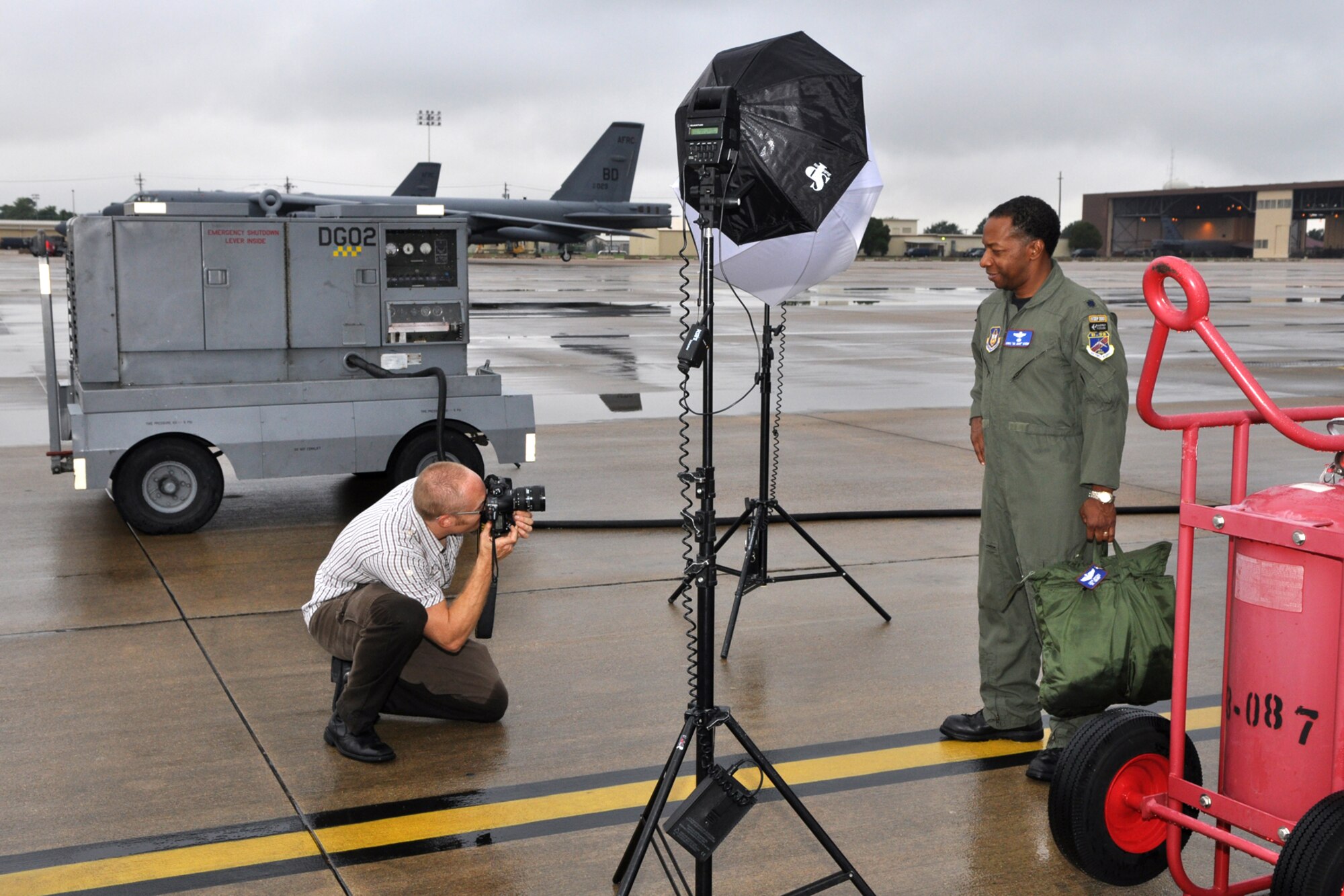 Lt. Col. Chris Myers, 93rd Bomb Squadron, instructor electronics warfare officer, strikes a pose for photographer Jason Flowers during a photo shoot at Barksdale Air Force Base, La., September 18, 2009. The photos will be used in a brochure for Texas A&M University-Commerce titled "To All Who Have Served in the Armed Services...Thank You." A&M-Commerce is a designated "Military Friendly" university and the brochure will help the university highlight recent veterans and active duty personnel who represent the student body and faculty. Colonel Myers is also known as Dr. Myers on the A&M-Commerce campus. (U.S. Air Force photo/Tech. Sgt. Jeff Walston)