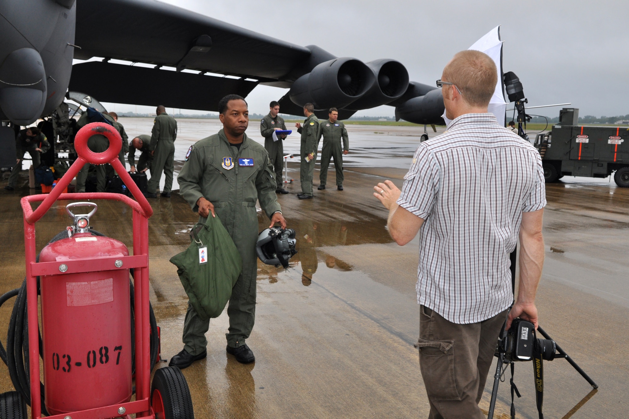 Lt. Col. Chris Myers, 93rd Bomb Squadron, instructor electronics warfare officer, receives instructions from photographer Jason Flowers during a photo shoot at Barksdale Air Force Base, La., September 18, 2009. The photos will be used in a brochure for Texas A&M University-Commerce titled "To All Who Have Served in the Armed Services...Thank You." A&M-Commerce is a designated "Military Friendly" university and the brochure will help the university highlight recent veterans and active duty personnel who represent the student body and faculty. Colonel Myers is also known as Dr. Myers on the A&M-Commerce campus. (U.S. Air Force photo/Tech. Sgt. Jeff Walston)