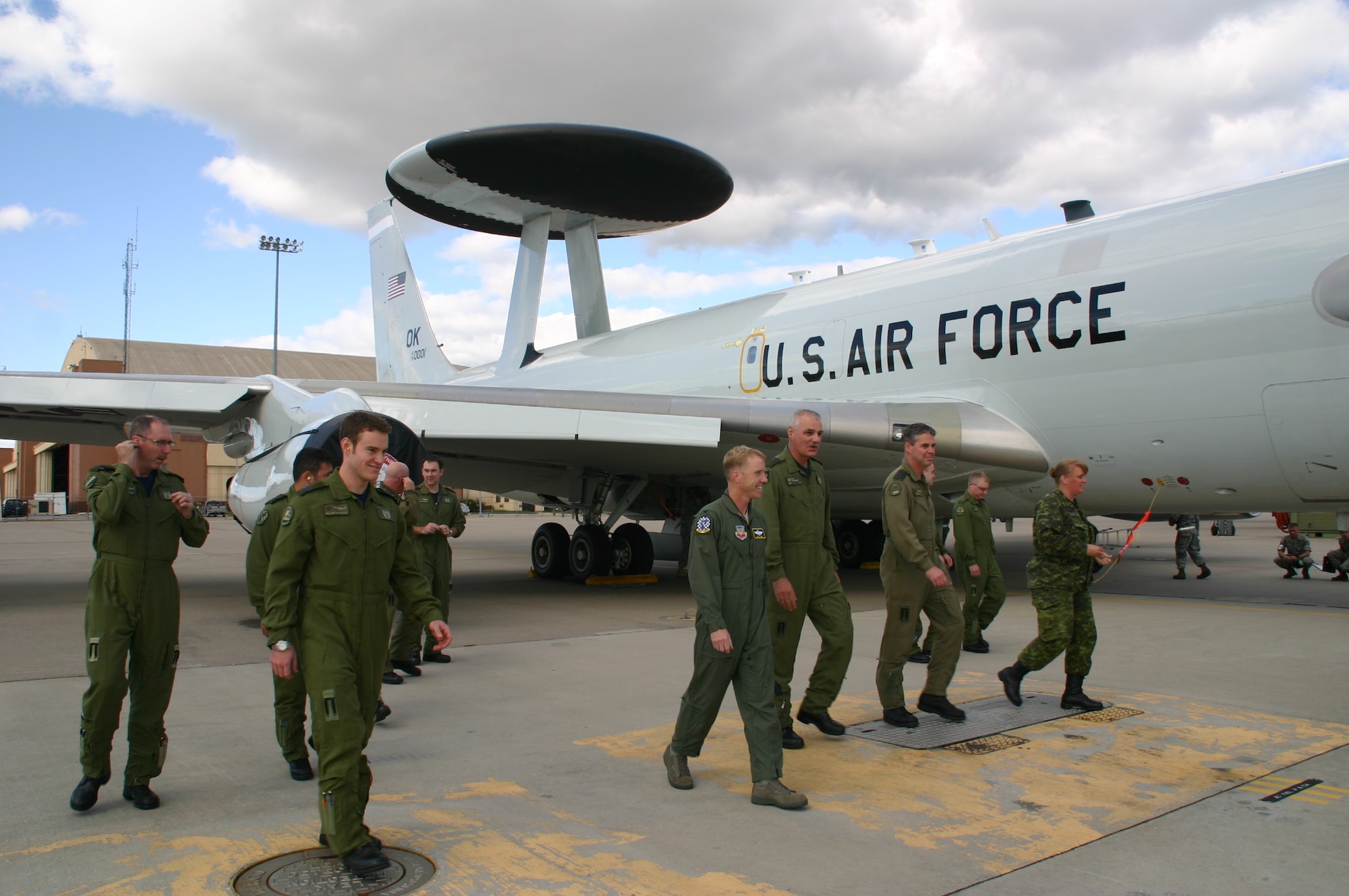 Col. Scott Forest, vice commander, 552 ACW, walks away from the jet with his fellow crewmembers after taking distinguished visitor, Maj. Gen. Pierre Forgues, NORAD J3, Canadian Forces, on an orientation flight September 22. The crew for the sortie was composed of almost entirely Canadians, a first in 552 ACW history. Photo courtesy of 1st Lt. Kinder Blacke.