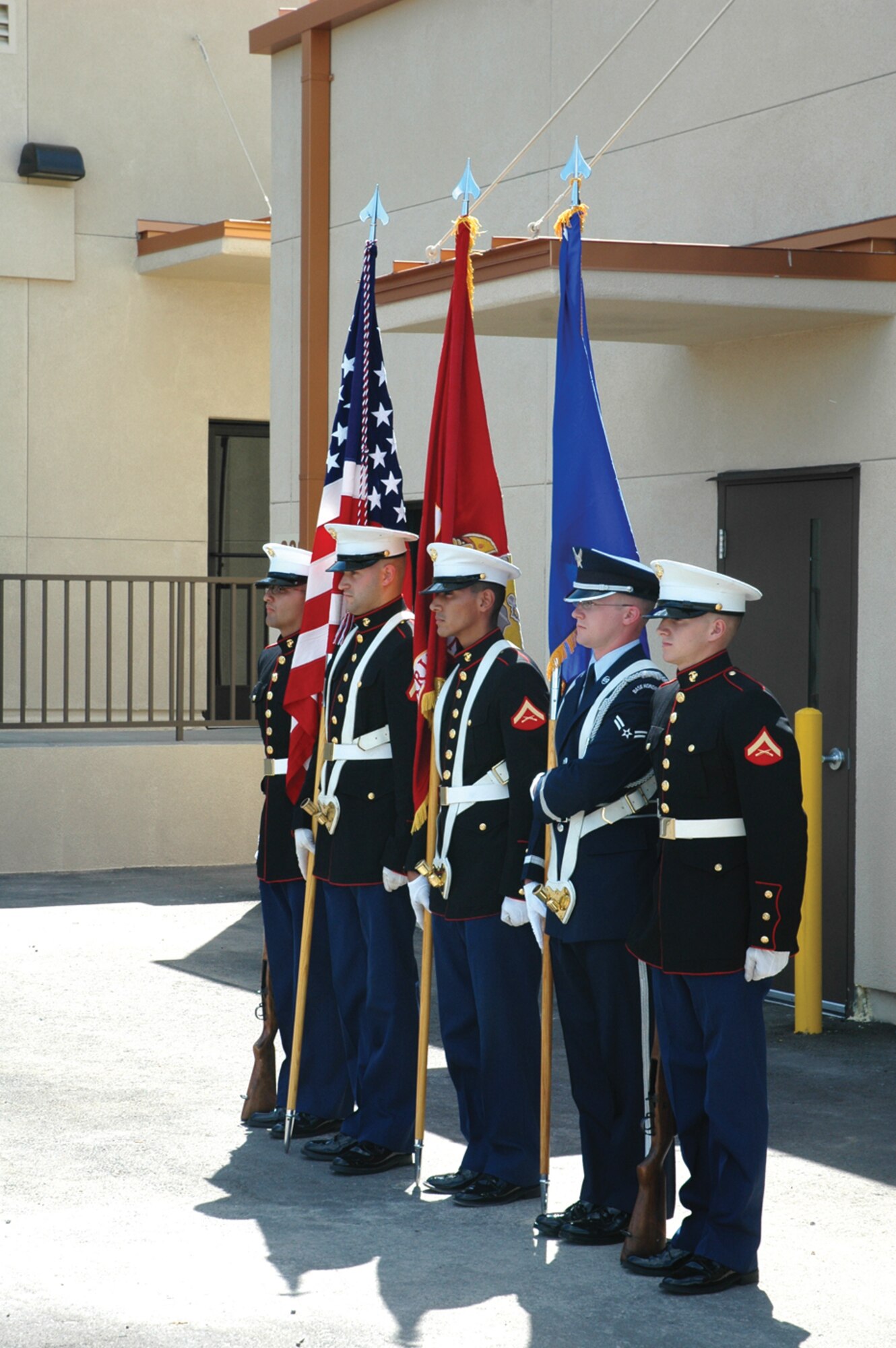 A joint force Honor Guard presents the colors Sept. 12 during a ribbon cutting of the new home of the Marine Corps 6th Engineer Support Battalion Bulk Fuel Company Charlie. (U.S. Air Force photo/Senior Airman Andre Bowser)
