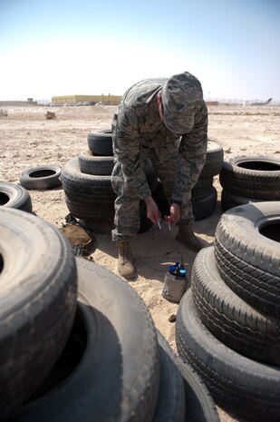 Staff Sgt. George Schmalz, 379th Expeditionary Civil Engineer Squadron explosive ordnance disposal craftsman, prepares to connect wire leads to a training device, Sept. 18, in Southwest Asia.The 379 EOD team trains on a variety of simulated situations continually to ensure mission readiness. Sergeant Schamlz is deployed from Charleston Air Force Base, S.C., in support of Operations Iraqi and Enduring Freedom. (U.S. Air Force photo/Staff Sgt. Robert Barney) 
