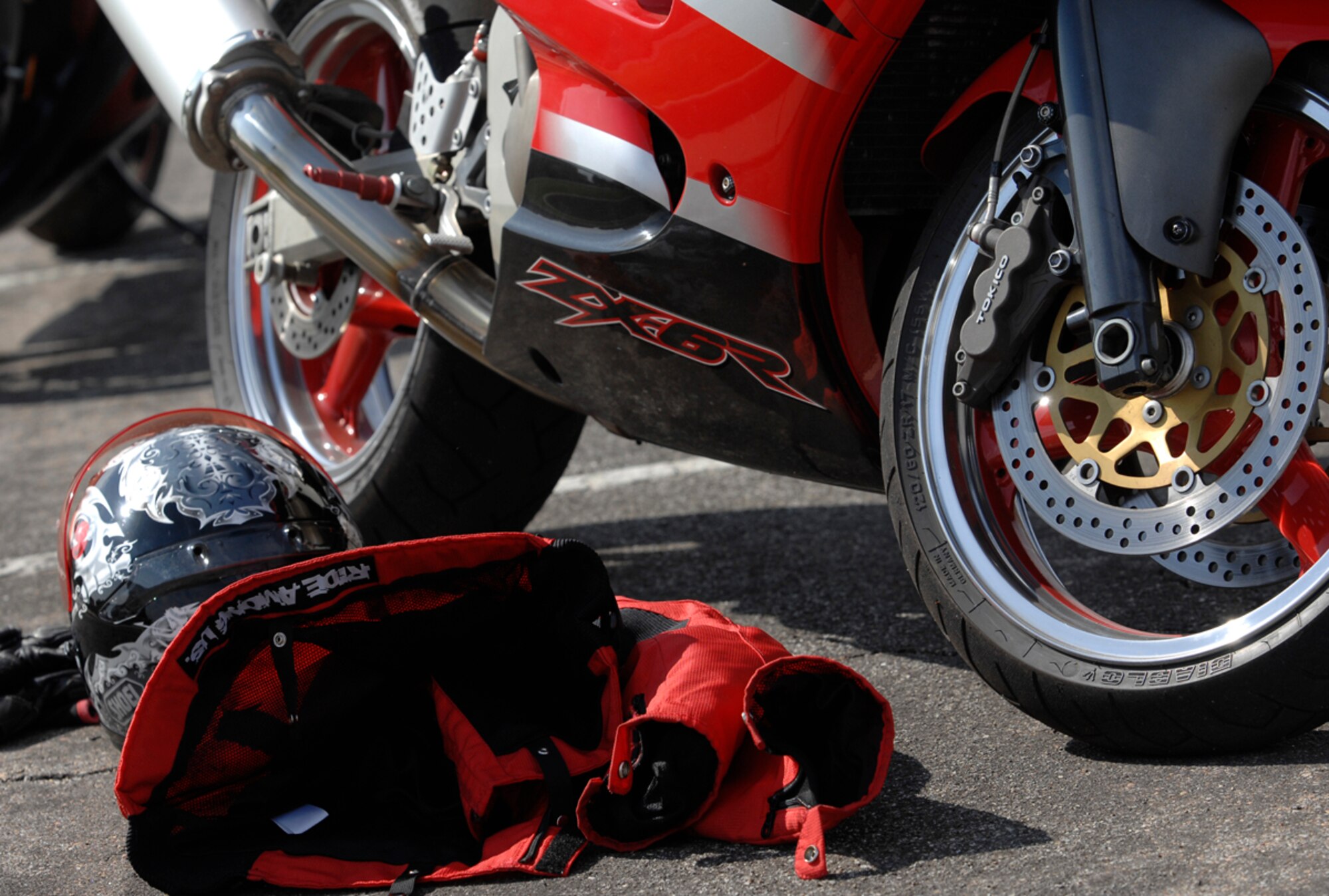 According to Air Mobility Command safety experts, as the popularity of sport bikes grows among Airmen, so does the number of injuries and fatalities. McConnell Airmen are required to wear a helmet, eye protection, a long-sleeved upper garment, long pants, sturdy, over-the-ankle footwear and full-fingered gloves when riding sport bikes or motorcycles. (U.S. Air Force photo/Senior Airman Jessica Lockoski)