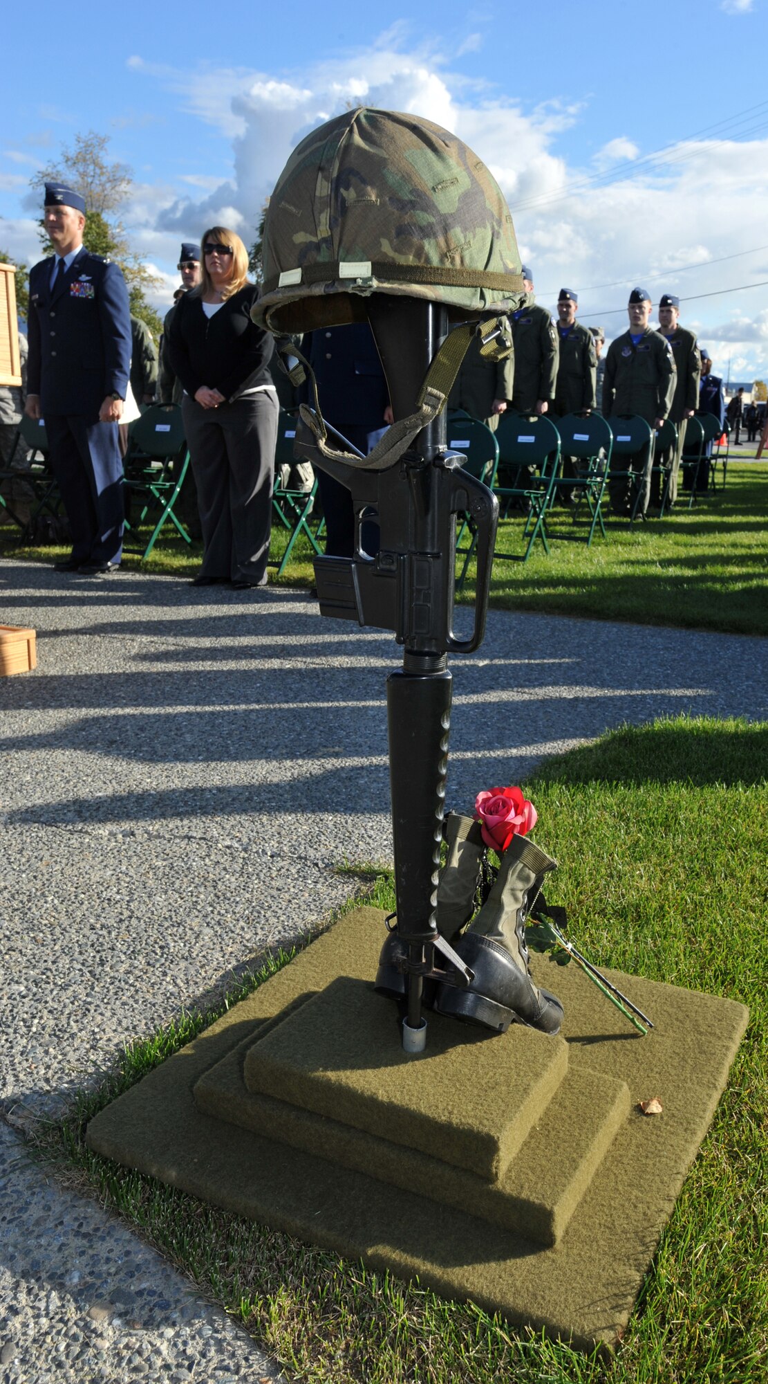 ELMENDORF AIR FORCE BASE, Alaska -- A worn rifle, a pair of boots, a set of dogtags, a helmet, and a red and a black rose stand as a memorial to fallen soldiers during the POW/MIA Memorial Sept. 18, 2009. The memorial honored our prisoners of war and those still missing in action. (U.S. Air Force photo/Senior Airman Laura Turner)