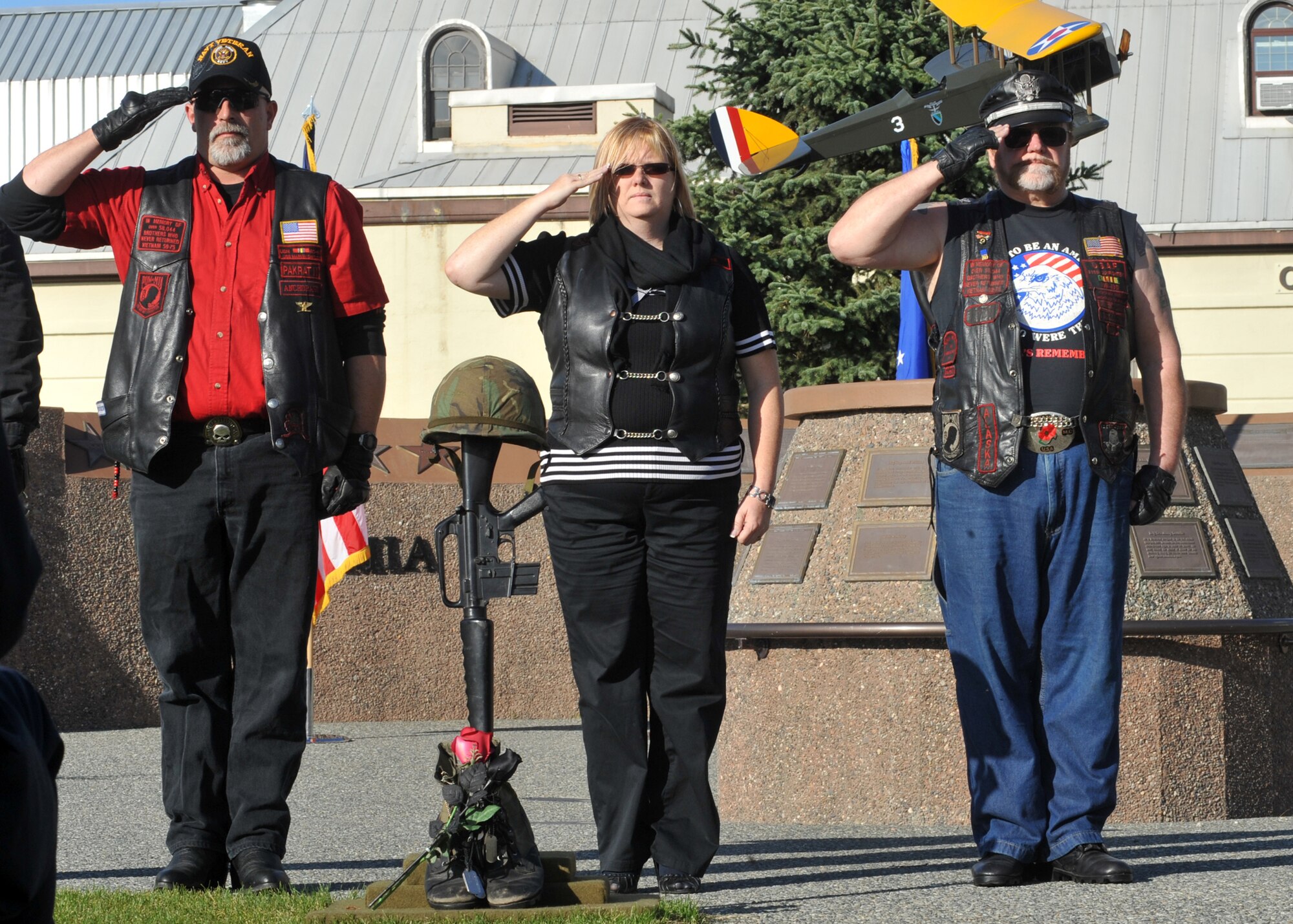 ELMENDORF AIR FORCE BASE, Alaska -- Members of the Vietnam Veterans Motorcycle Club salute the fallen soldier ceremonial display during the POW/MIA Memorial Sept. 18, 2009. The history of the Fallen Warrior Ceremony was read by Vietnam veteran Chris ?Fog? Wetmore. (U.S. Air Force photo/Senior Airman Laura Turner)