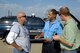 Assistant airfield manager, Charles Grant, center, conducts a random check for airfield drivers licenses to make sure that everyone on the airfield is trained and qualified. Mr. Grant validates everyone from Security Force to contractors. Left is Greg Ott and right is Erik Dahlgren, both KC-135 post dock members. (Air Force photo by Margo Wright)