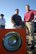 Benjamin Barker, center, airfield manager, and Marc Bradley, airfield operations manager, right, are two members of a team that helps keep Tinker’s airfield running safely and smoothly. They are working with contractors to survey the work about to begin on the runway’s sequence flashing lights.  (Air Force photo by Margo Wright)