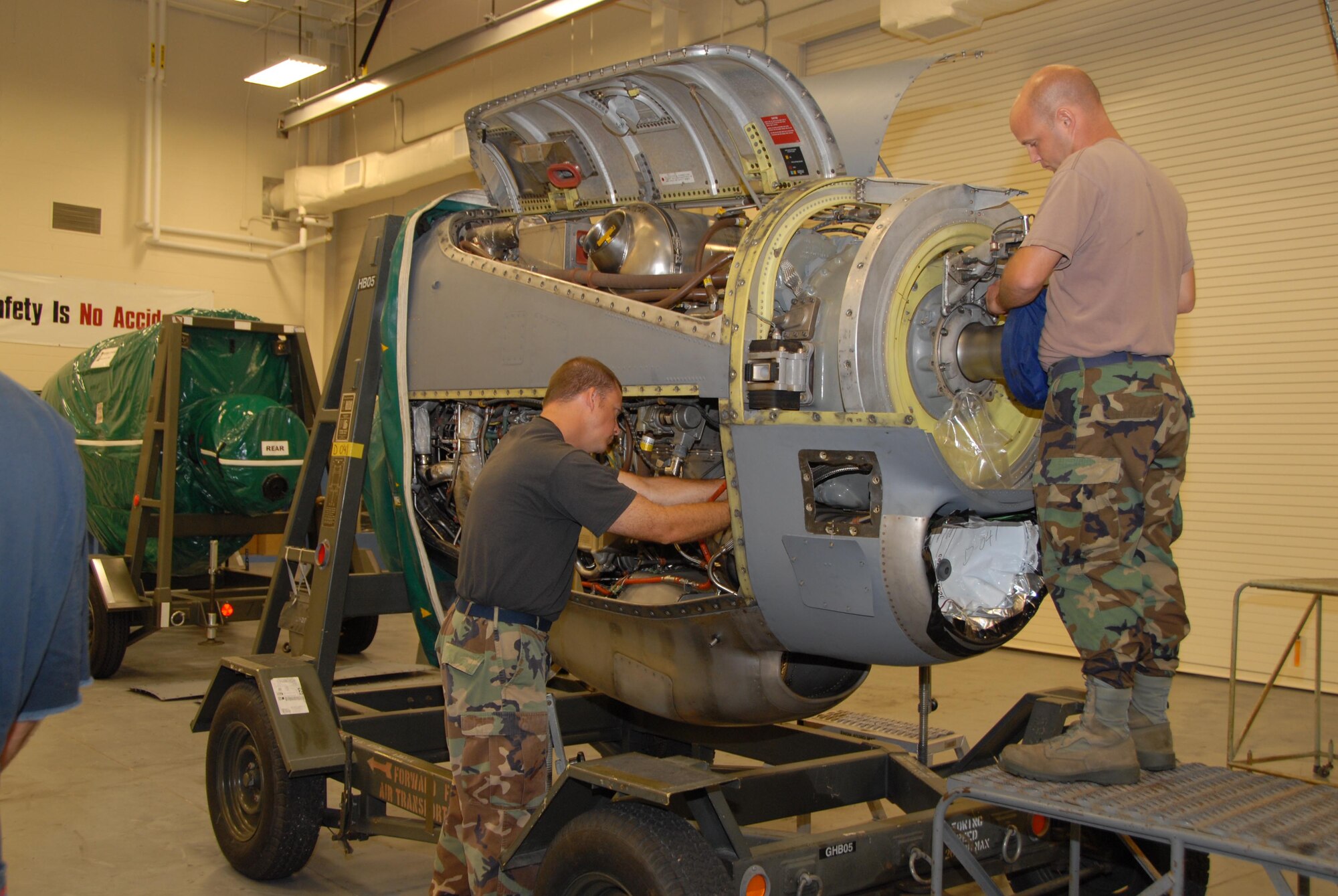 The 403rd Maintenance Group is always busy. Tech. Sgt. Brian Vines and Staff Sgt. Ronnie Graham with the propulsions shop prepare a c-130J turbine engine for a new gear box. (U.S. Air Force Photo by Senior Airman Tabitha Dupas)