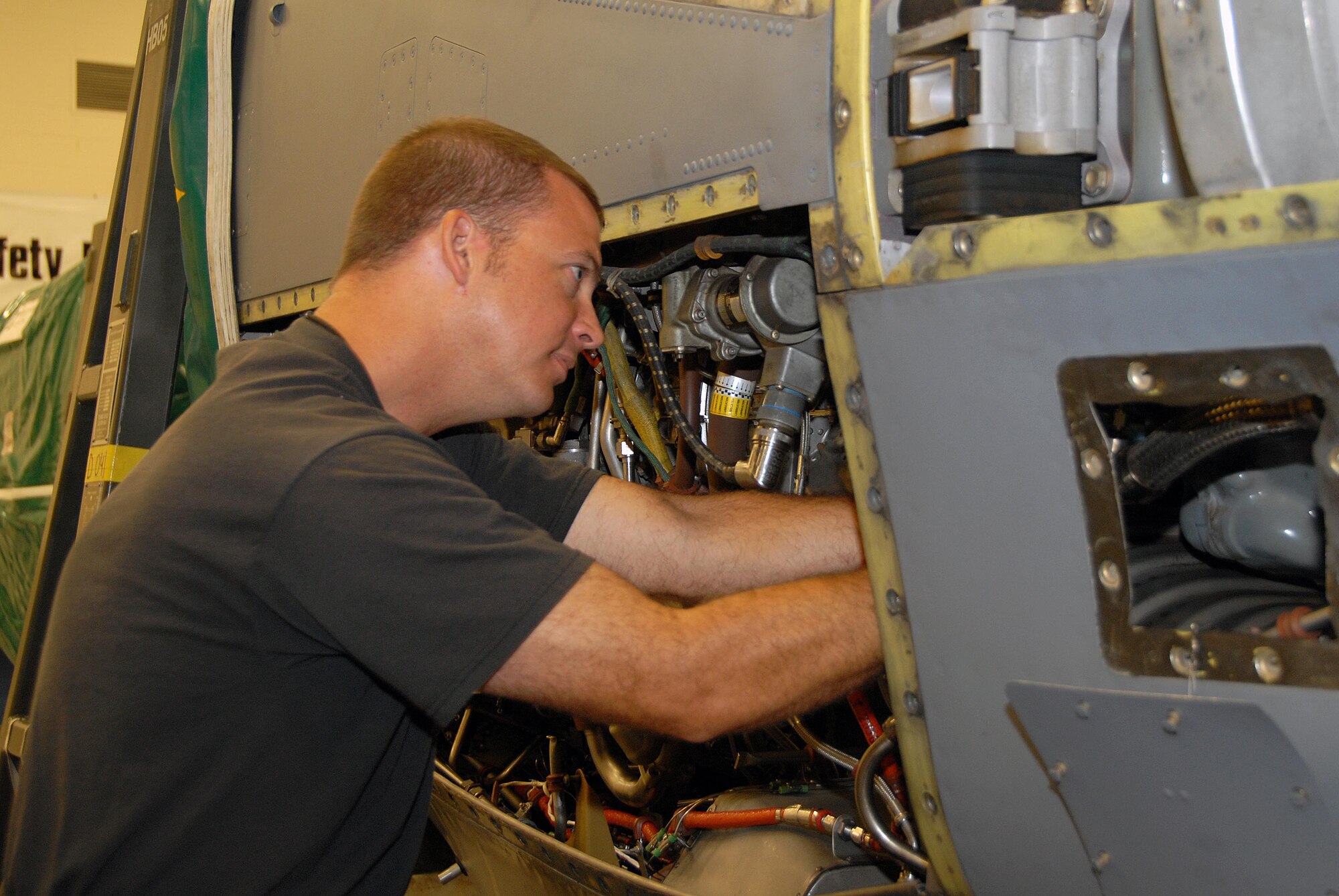 Tech. Sgt. Brian Vines is doing maintenance on the turbine engine of a C-130J to replace the gear box. Sergeant Vines works in the propulsion shop of the 403rd Maintenance Group. (U.S. Air Force Photo by Senior Airman Tabitha Dupas)