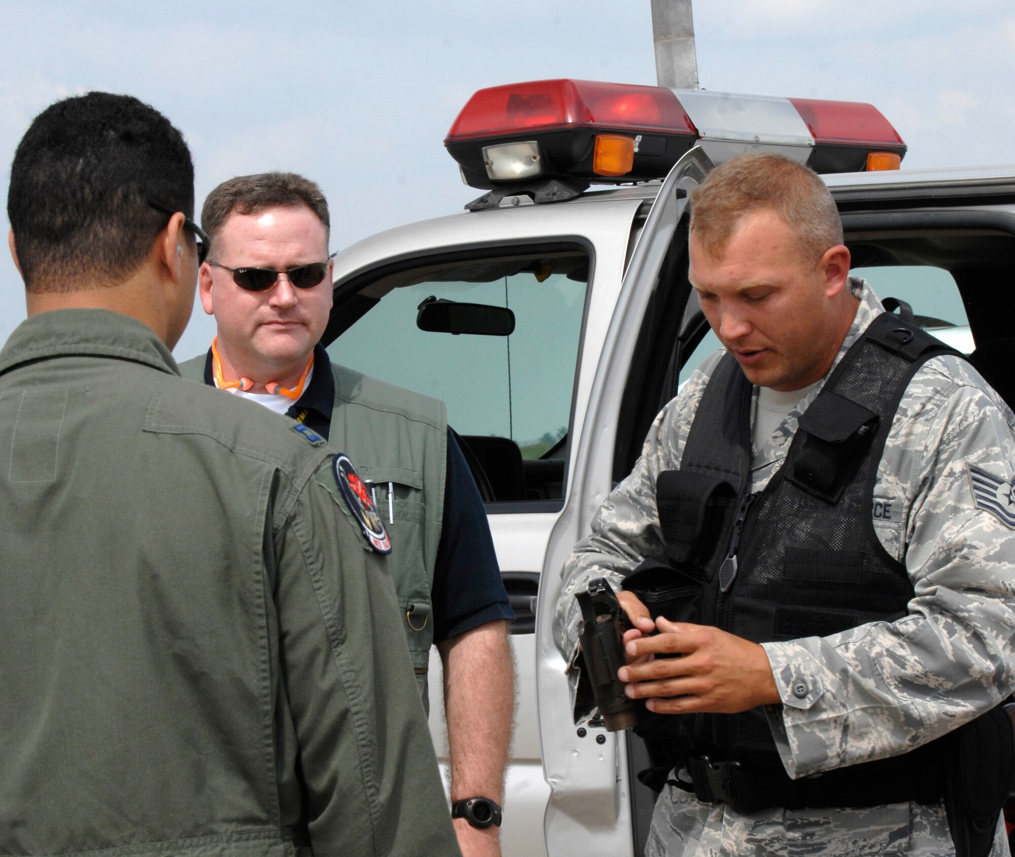 Tech. Sgt. Mark Hellwig, 22nd Air Refueling Wing Safety, loads a flare gun for Capt. Jeremy Broussard, 350th Air Refueling Squadron unit safety representative, and Master Sgt. David Parker, 22nd ARW Safety, Sept. 16, 2009, during Bird Aviation Strike Hazard program training at McConnell Air Force Base, Kan. Flight safety representatives learned BASH program techniques during the training. In September 2008, the Air Force totaled more than three million dollars in damages due to bird strikes. (U.S. Air Force photo/Senior Airman Laura Suttles)
