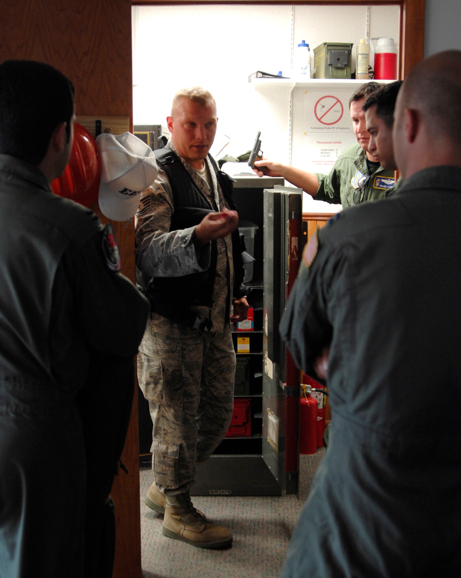 Tech. Sgt. Mark Hellwig, 22nd Air Refueling Wing Safety, shows unit safety representatives different types of ammunition used to help reduce bird-strikes during a training session at McConnell Air Force Base, Kan., Sept. 16, 2009.  Flight safety representatives learned about various weapons and ammo, so they can participate in the Bird Aviation Strike Hazard program. The BASH program employs several methods to deter animals from entering airfield space to include non-lethal weapons, habitat reduction, pyrotechnics and depredation. (U.S. Air Force photo/Senior Airman Laura Suttles)