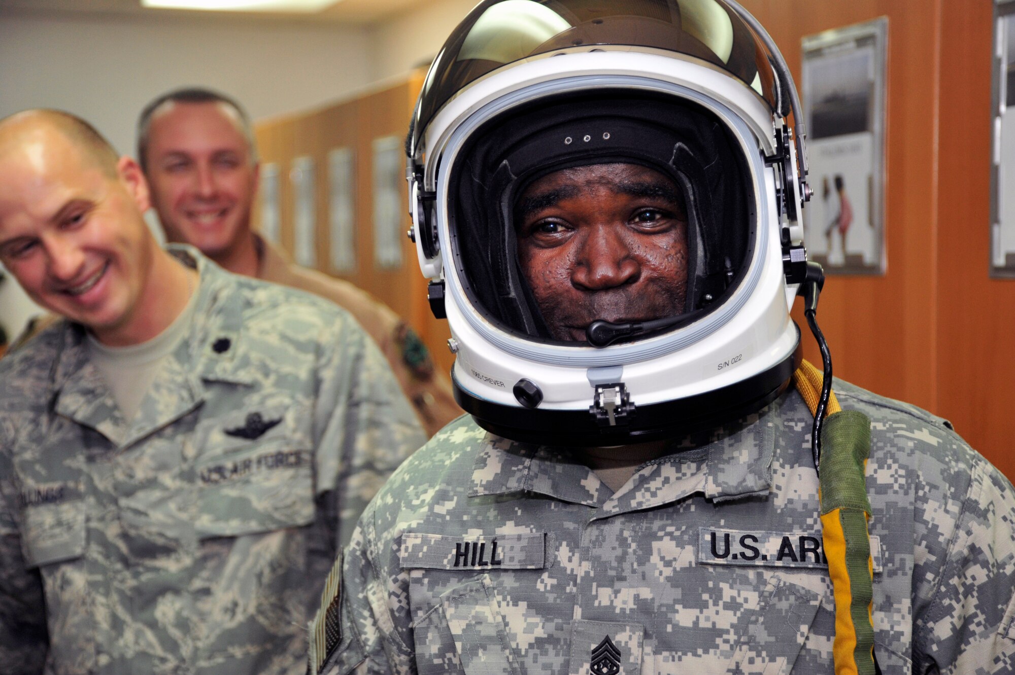 SOUTHWEST ASIA -Command Sgt. Maj. Marvin Hill, U.S. Central Command, command senior enlisted leader, tries on a U-2 pilot helmet while touring the 99th Expeditionary Reconnaissance Squadron here Sept. 23, 2009. Command Sergeant Major Hill is stationed at MacDill Air Force Base, Fla. (U.S. Air Force photo/Tech. Sgt. Charles Larkin Sr)