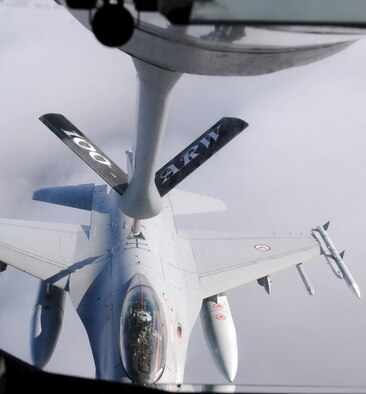 RAF MILDENHALL, England -- A Royal Norwegian Air Force F-16 Fighting Falcon receives gas from a 351st Air Refueling Squadron KC-135 Stratotanker over the North Sea. The 351st ARS refueled aircraft for Exercise Bold Avenger 2009, held at Karup Air Base, Denmark, Sept. 23. This particular KC-135 serviced 18 individual receivers and delivered more than 99,000 pounds of JP-8 aviation fuel. (U.S. Air Force photo/Senior Airman Thomas Trower) 