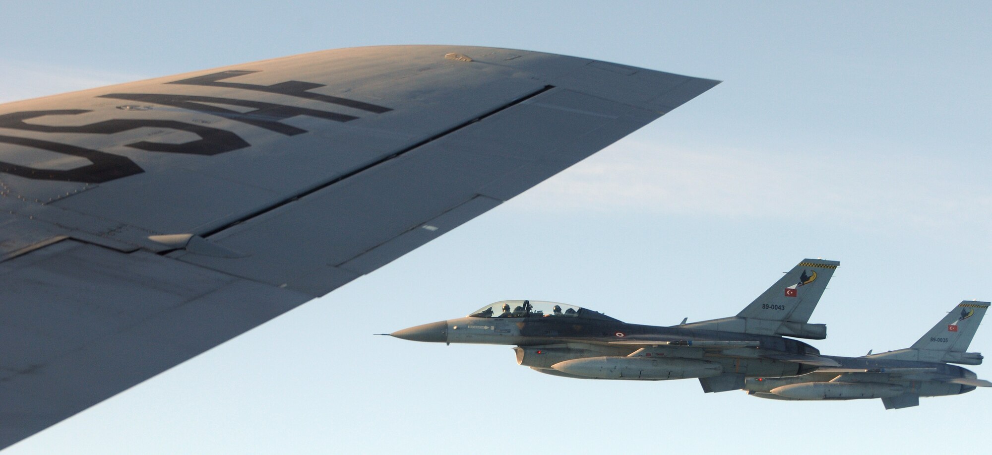 RAF MILDENHALL, England -- Two Turkish Air Force F-16 Fighting Falcons fly alongside a 351st Air Refueling Squadron KC-135 Stratotanker over the North Sea during a refueling mission in support of Exercise Bold Avenger 2009, held at Karup Air Base, Denmark, Sept. 23. The KC-135 refueled 18 Fighting Falcons from the Turkish, Royal Danish, Royal Netherlands and Royal Norwegian Air Forces, delivering more than 99,000 pounds of jet fuel. (U.S. Air Force photo/Senior Airman Thomas Trower)