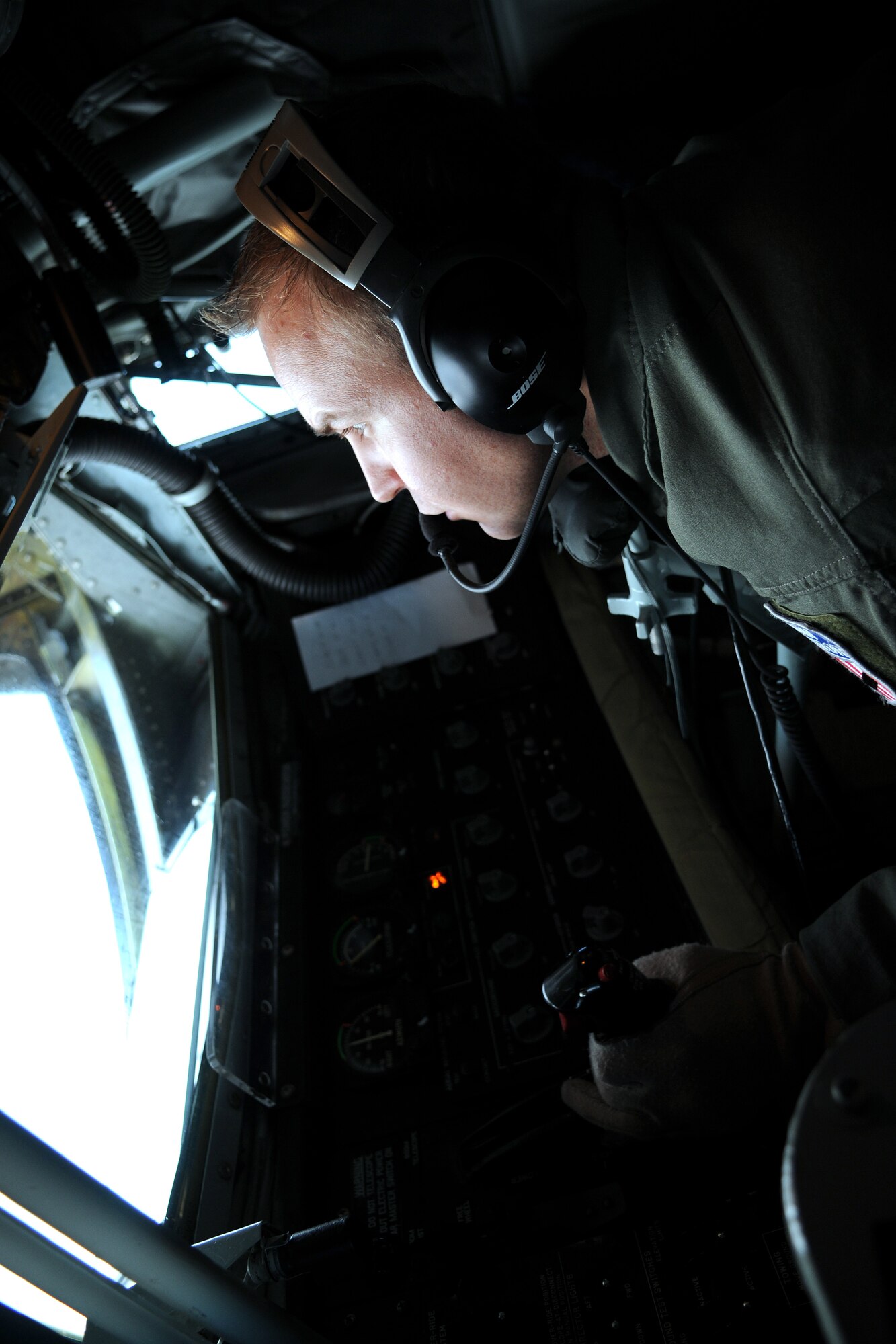 RAF MILDENHALL, England -- Staff Sgt. Heath Tuma, 351st Air Refueling Squadron, directs the boom of a KC-135 Stratotanker into a recieving jet in support of Exercise Bold Avenger over the North Sea Sept. 23. The Stratotanker crew supported the exercise, based at Karup Air Base, Denmark, with 99,000 pounds of JP-8 aviation fuel. Sergeant Tuma serviced 18 F-16 Fighting Falcons from the Turkish, Royal Danish, Royal Netherlands and Royal Norwegian Air Forces. (U.S. Air Force photo/Senior Airman Thomas Trower)