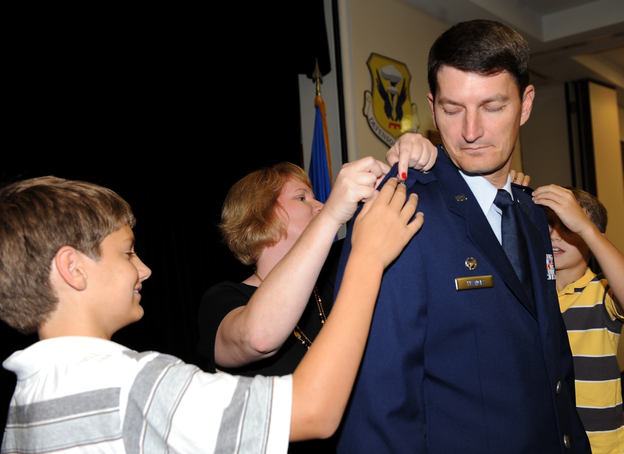 WHITEMAN AIR FORCE BASE, Mo. – Lt. Col. Michael Francis, 131st Operations Group commander, receives his promotion to the rank of colonel as his family pins on his rank, Sept. 23. The rank of colonel is a senior field grade military officer rank just above the rank of lieutenant colonel and just below the rank of brigadier general.  (U.S. Air Force photo/Senior Airman Cory Todd)